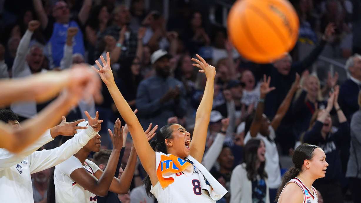 UConn center Jana El Alfy (8) reacts after teammate Blanca QuiÒonez, not visible, scored a three-point basket against the Notre Dame during the second half in the Elite Eight of the NCAA college basketball tournament, Sunday, March 29, 2026, in Fort Worth, Texas.