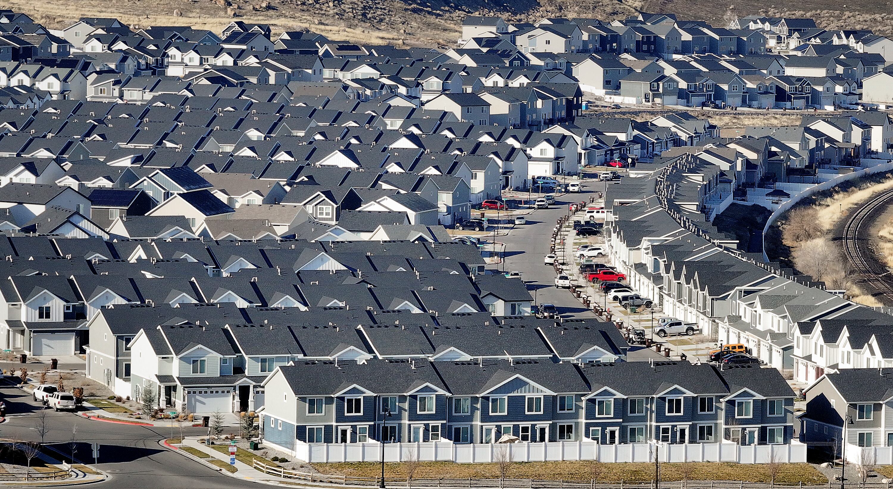 Homes are pictured in Magna on Dec. 30. Freddie Mac reported that mortgage rates rose for the fifth consecutive week.