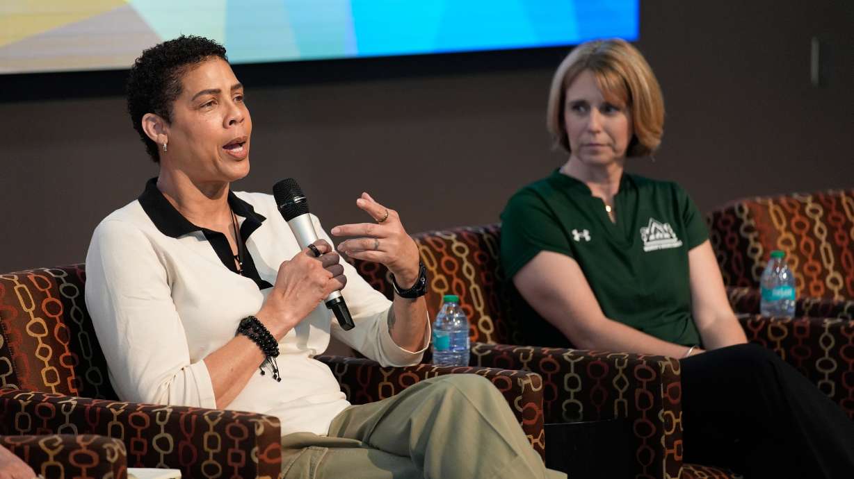 Former Basketball player Cheryl Miller speaks beside Julie Church, Delta State women's basketball assistant coach, during an event Thursday, April 2, 2026, in Phoenix.