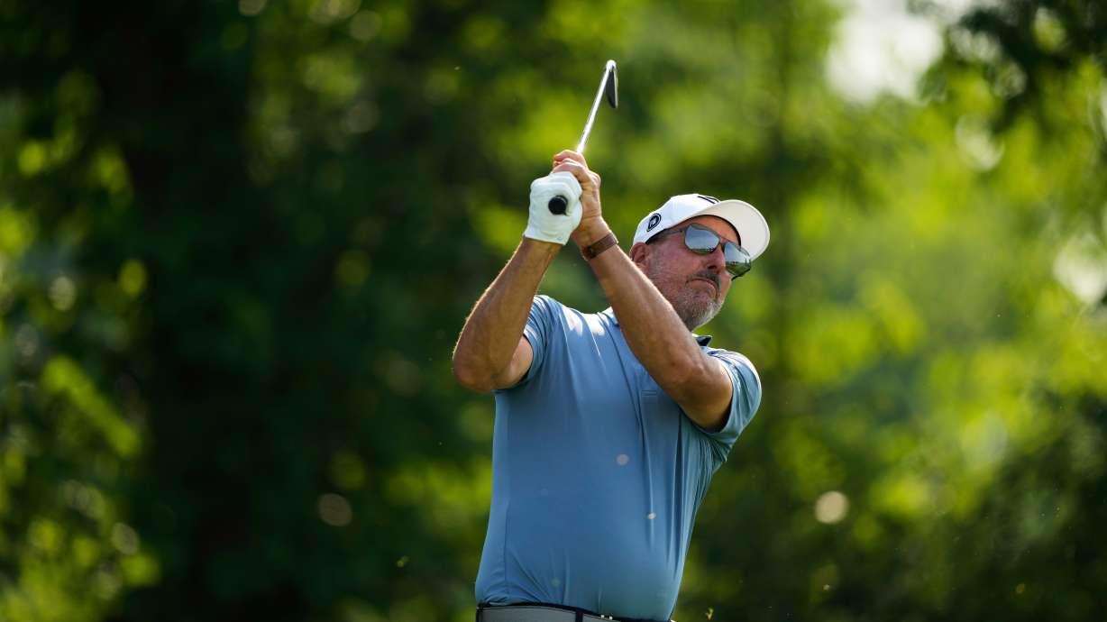 FILE - Phil Mickelson tees off on the 13th hole during the first round of the U.S. Open golf tournament at Oakmont Country Club, June 12, 2025, in Oakmont, Pa.