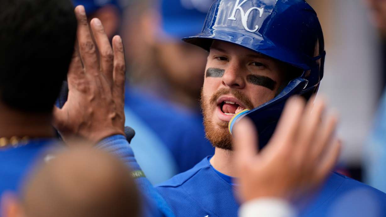 Kansas City Royals' Bobby Witt Jr. (7) celebrates scoring on a sacrafice fly by Kansas City Royals' Carter Jensen in the seventh inning of a baseball game against the Atlanta Braves, Sunday, March 29, 2026, in Atlanta.