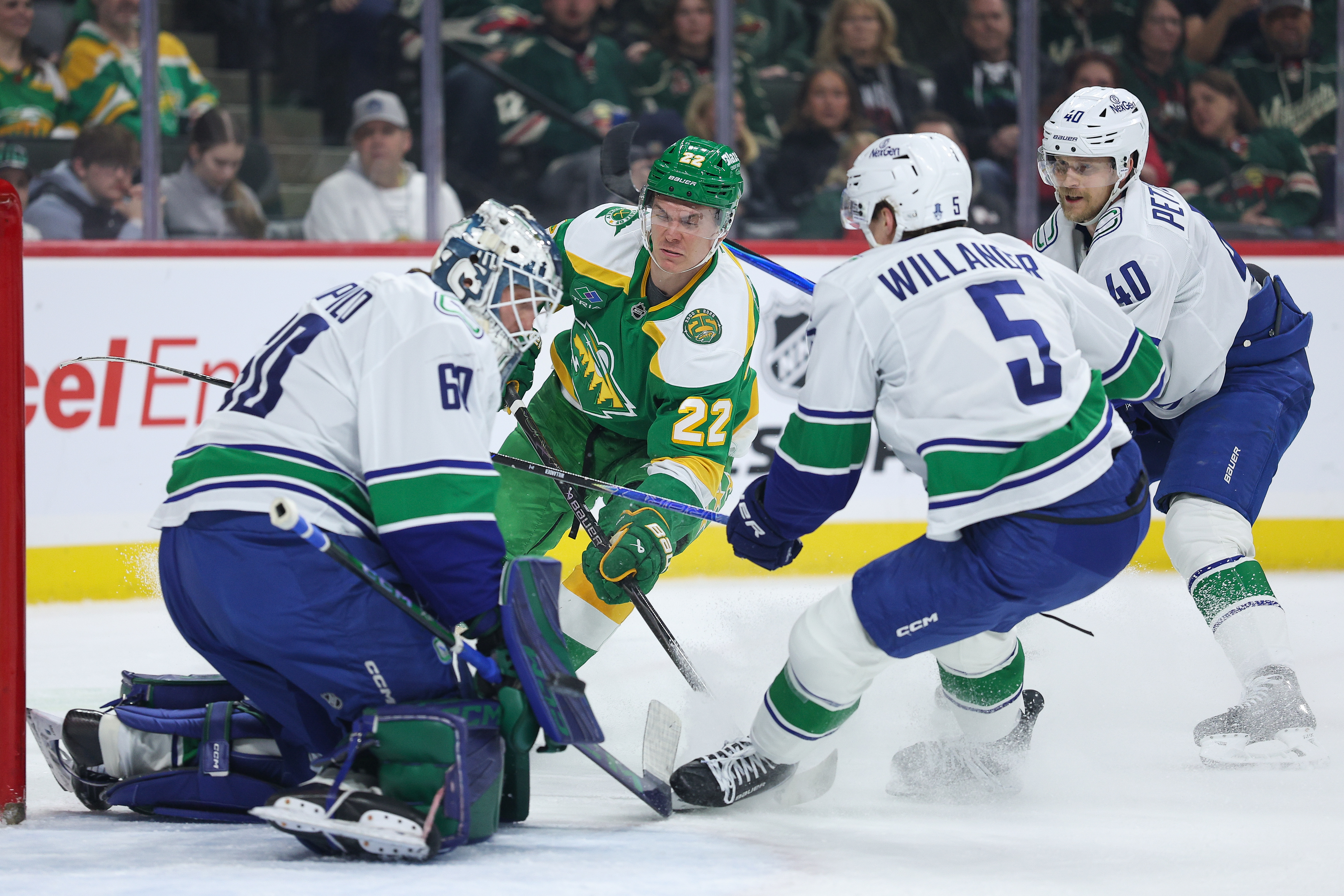 Wild wrap up a playoff spot with 5-2 victory over the Canucks