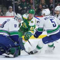 Wild wrap up a playoff spot with 5-2 victory over the Canucks