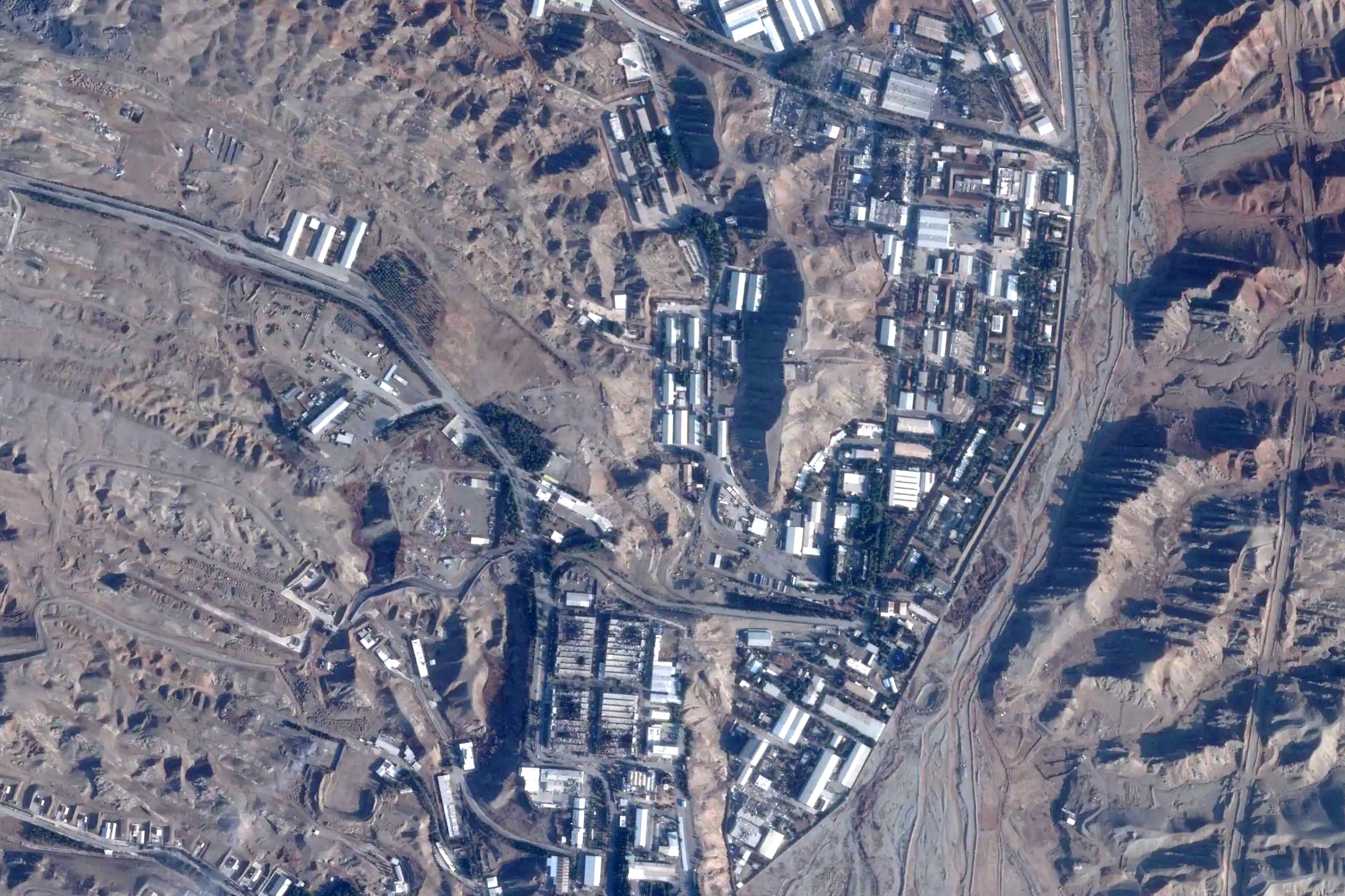 This satellite image from Planet Labs PBC shows damage after airstrikes targeting Iran's Parchin military base outside of Tehran, Iran, March 6. President Donald Trump on Wednesday said the U.S. goals in Iran were nearly complete, but did not give a timeline to wind down the conflict.