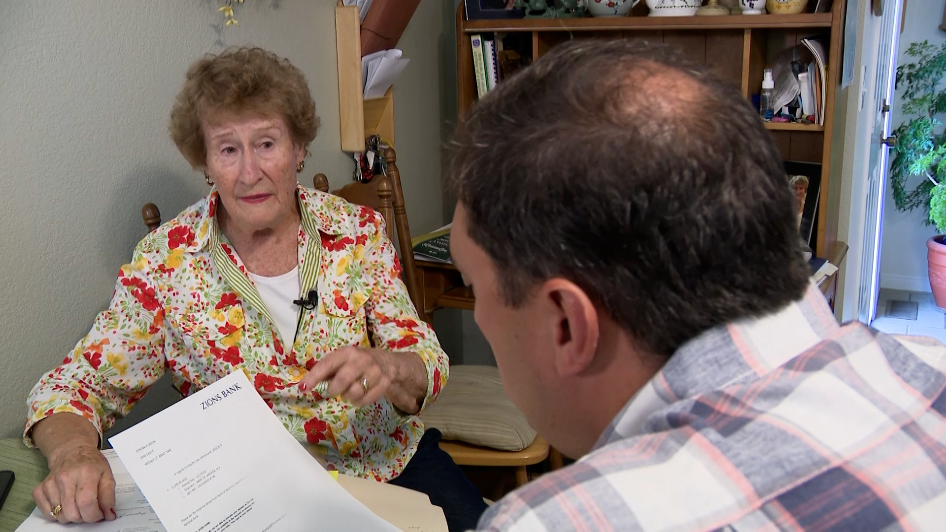 Edwina Greene shows KSL’s Matt Gephardt showing her $1,000 was transferred to her former bank, Thursday. Greene accidentally sent the transfer, and fixing it has caused her more headaches.