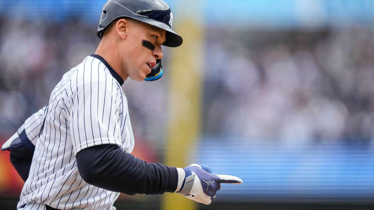 New York Yankees' Aaron Judge (99) celebrates after hitting a two-run home run during the first inning of the Yankees' home-opener baseball game against the Miami Marlins, Friday, April 3, 2026, in New York.