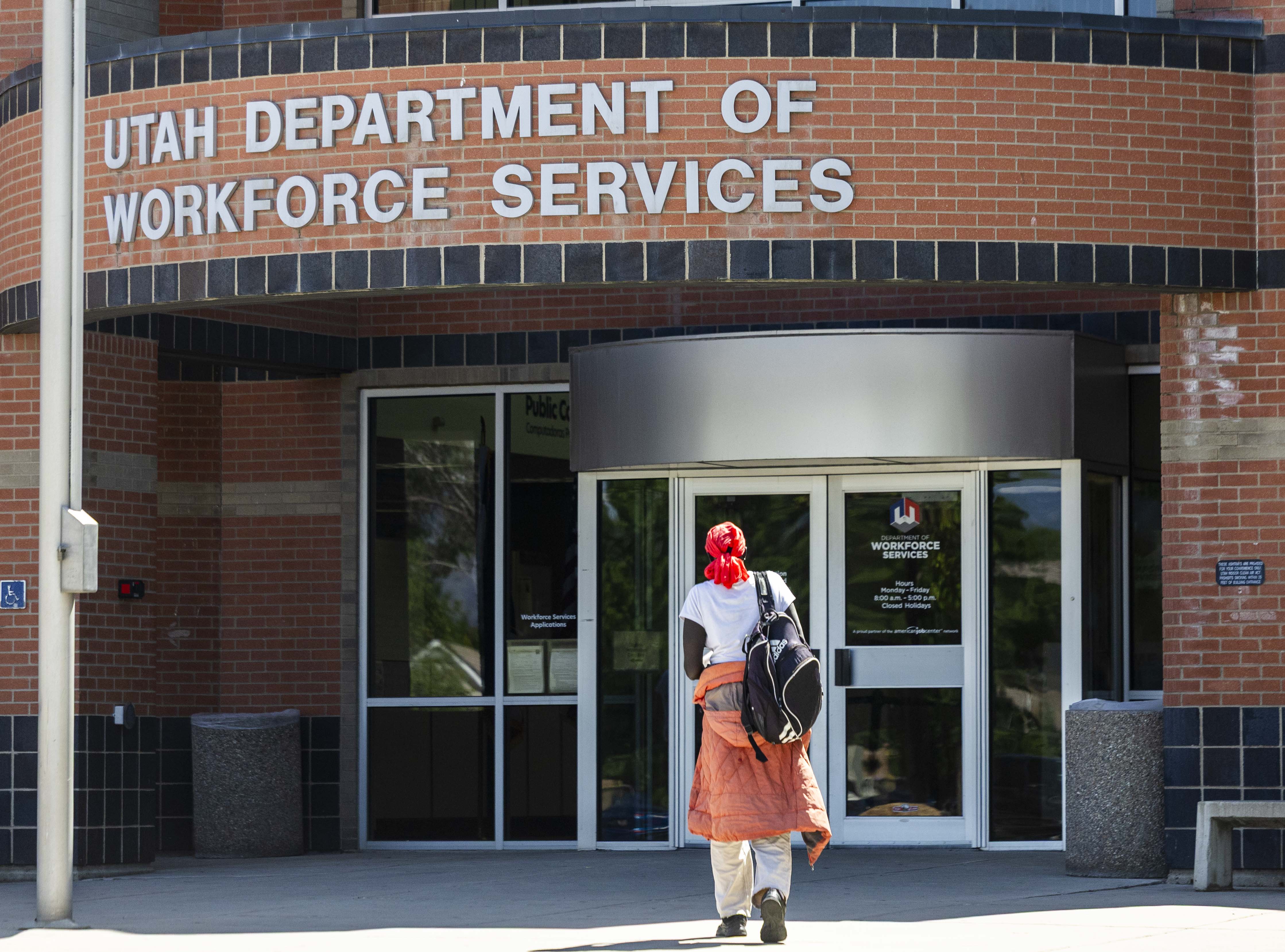 A person walks into the Utah Department of Workforce Services in Taylorsville on July 3. Rep. Burgess Owens unveiled the MATCH Act on Thursday to help modernize job matching systems.