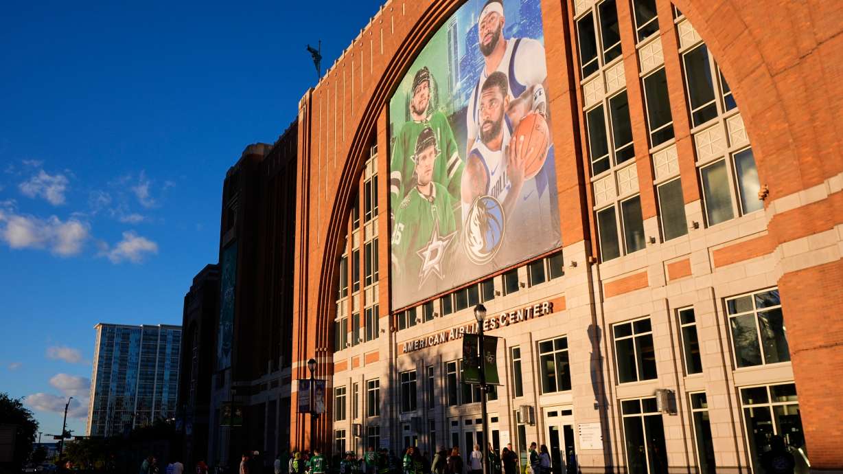 FILE - Fans line up outside the doors of American Airlines Center before the start of an NHL hockey game in Dallas, on Tuesday, Oct. 28, 2025.