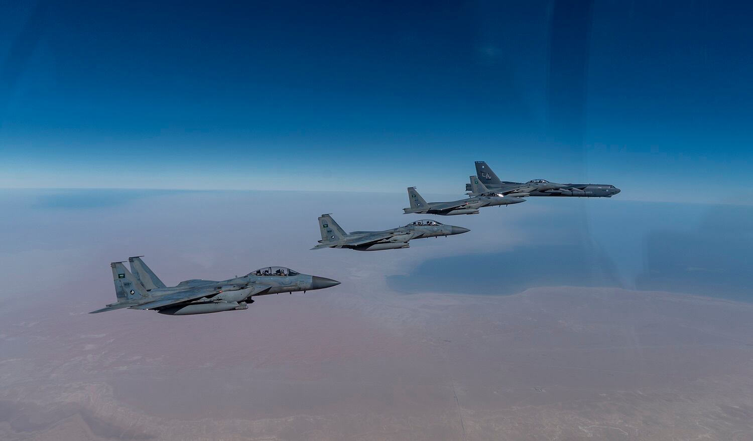 In this Jan. 27, 2021, handout photo, a B-52 bomber from the 2nd Bomb Wing of Barksdale Air Force Base in Louisiana, right, flies with Royal Saudi Air Force F-15s during a mission in the Middle East. Hill Air Force Base warned drone users of flying over military airspace, claiming it poses a danger to military personnel.