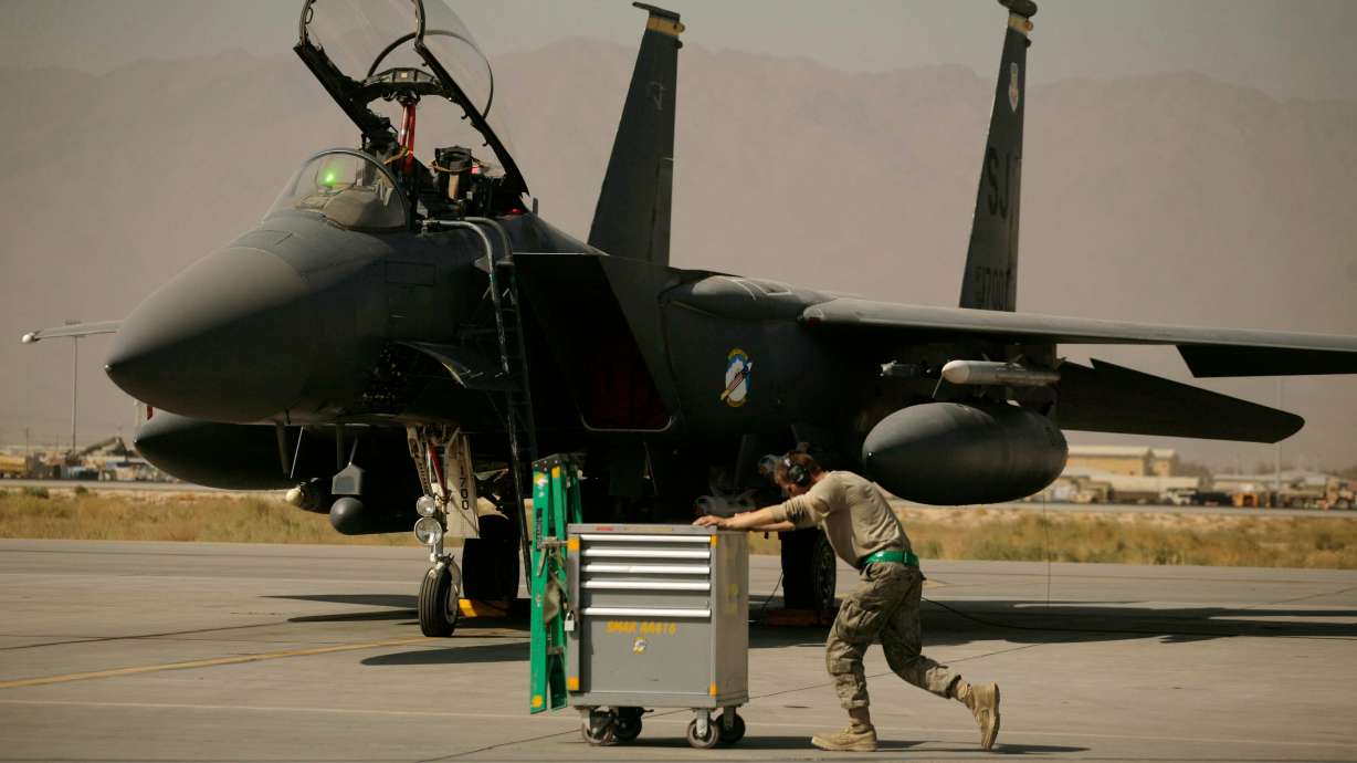 A U.S. Air Force airman pushes a cart past an F-15E Strike Eagle at Bagram Air Field in Afghanistan on Oct. 17, 2009. U.S. military jets hit in Iran war are the first shot down by enemy fire in over 20 years.