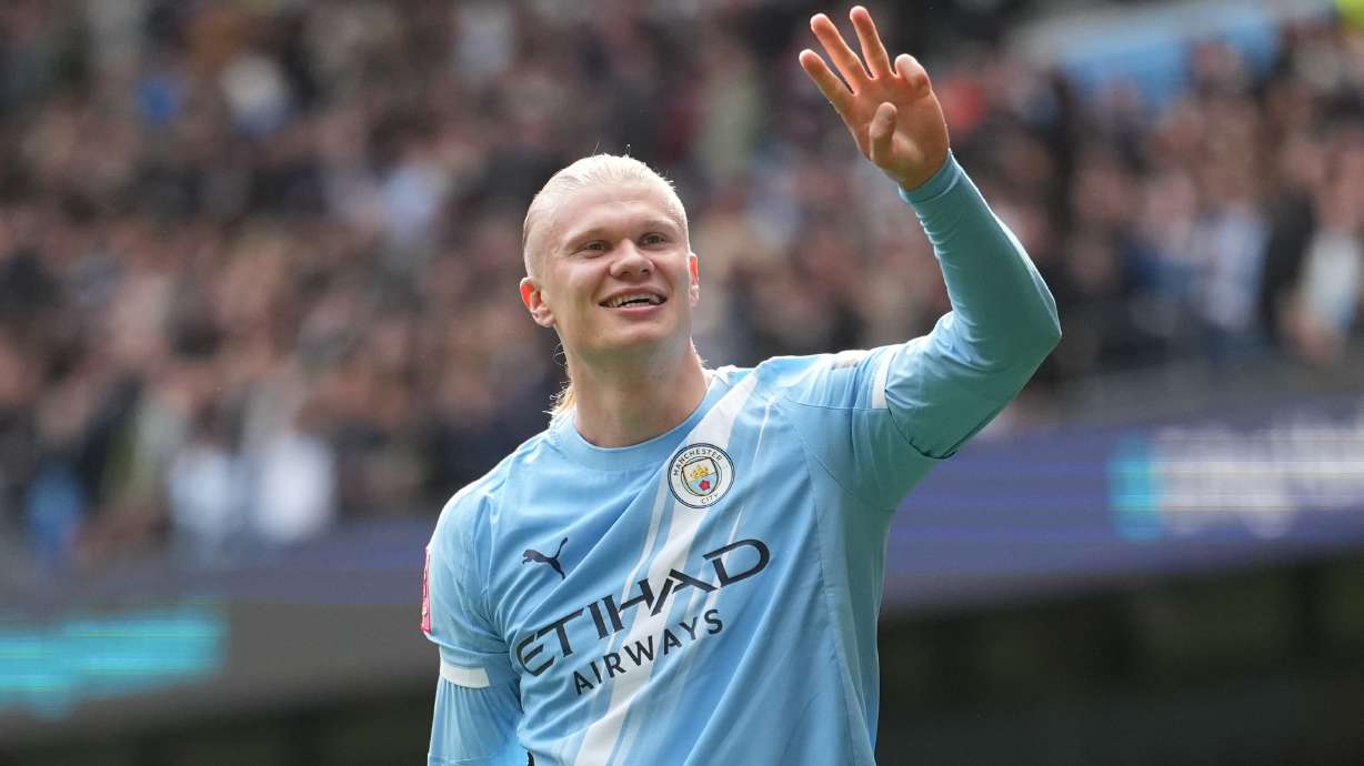 Manchester City's Erling Haaland celebrates after scoring his third goal during the FA Cup quarter-final soccer match between Manchester City and Liverpool in Manchester, England, Saturday, April 4, 2026.