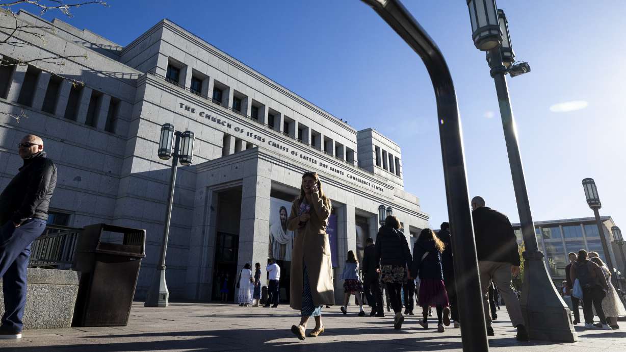 Conferencegoers walk outside the Conference Center before the Saturday morning session of the 196th Annual General Conference of The Church of Jesus Christ of Latter-day Saints, held in Salt Lake City on Saturday.