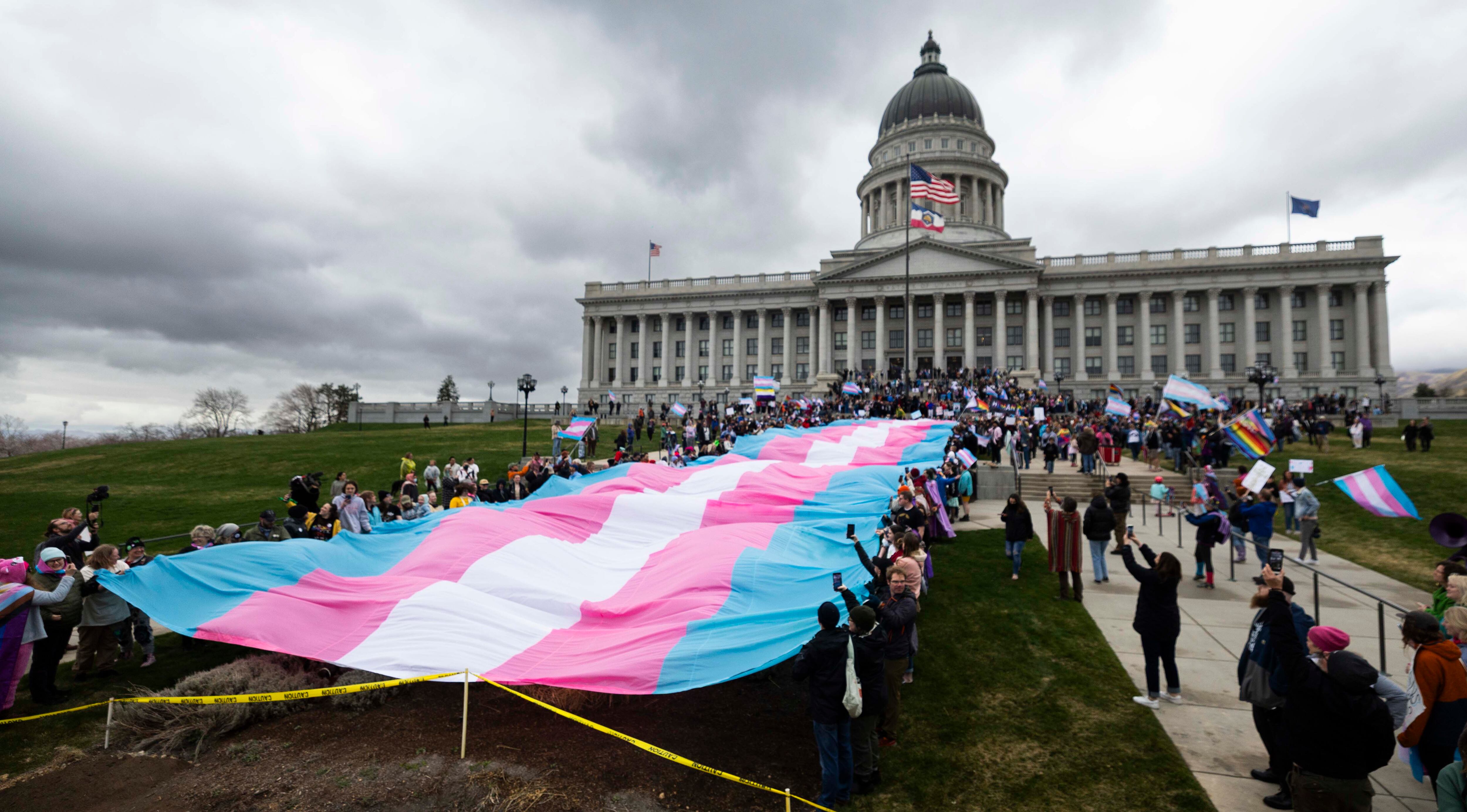 Protesters at the Capitol for Transgender Day of Visibility in Salt Lake City on March 29. A Utah review of youth transgender treatments has been critiqued by an international group.