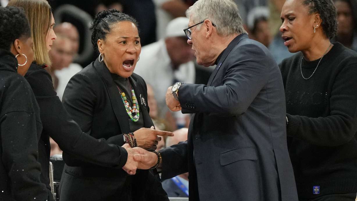 South Carolina head coach Dawn Staley, left, and UConn head coach Geno Auriemma argue after a woman's NCAA college basketball tournament semifinal game at the Final Four, Friday, April 3, 2026, in Phoenix.