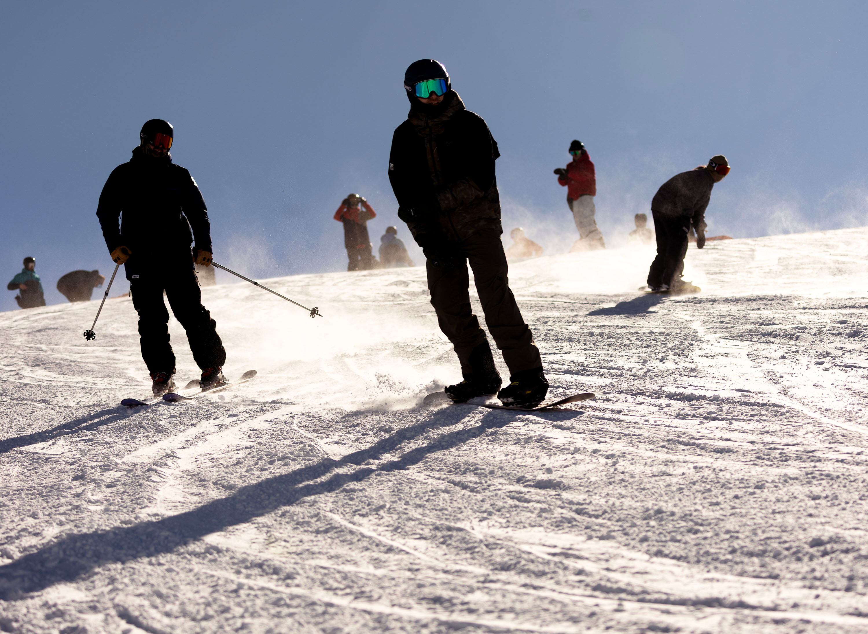 Snowboarders and skiers are pictured at Snowbird in Little Cottonwood Canyon on Jan. 9. The resort's owner is facing a lawsuit over daily lift ticket prices.