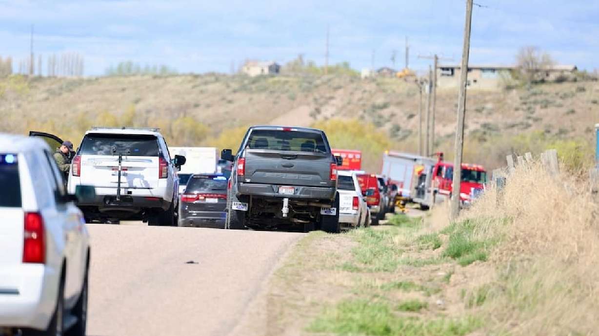 Power County, Idaho, police at the scene of a shooting on Tank Farm Road on Friday. Three people were killed and two were left injured, authorities said.
