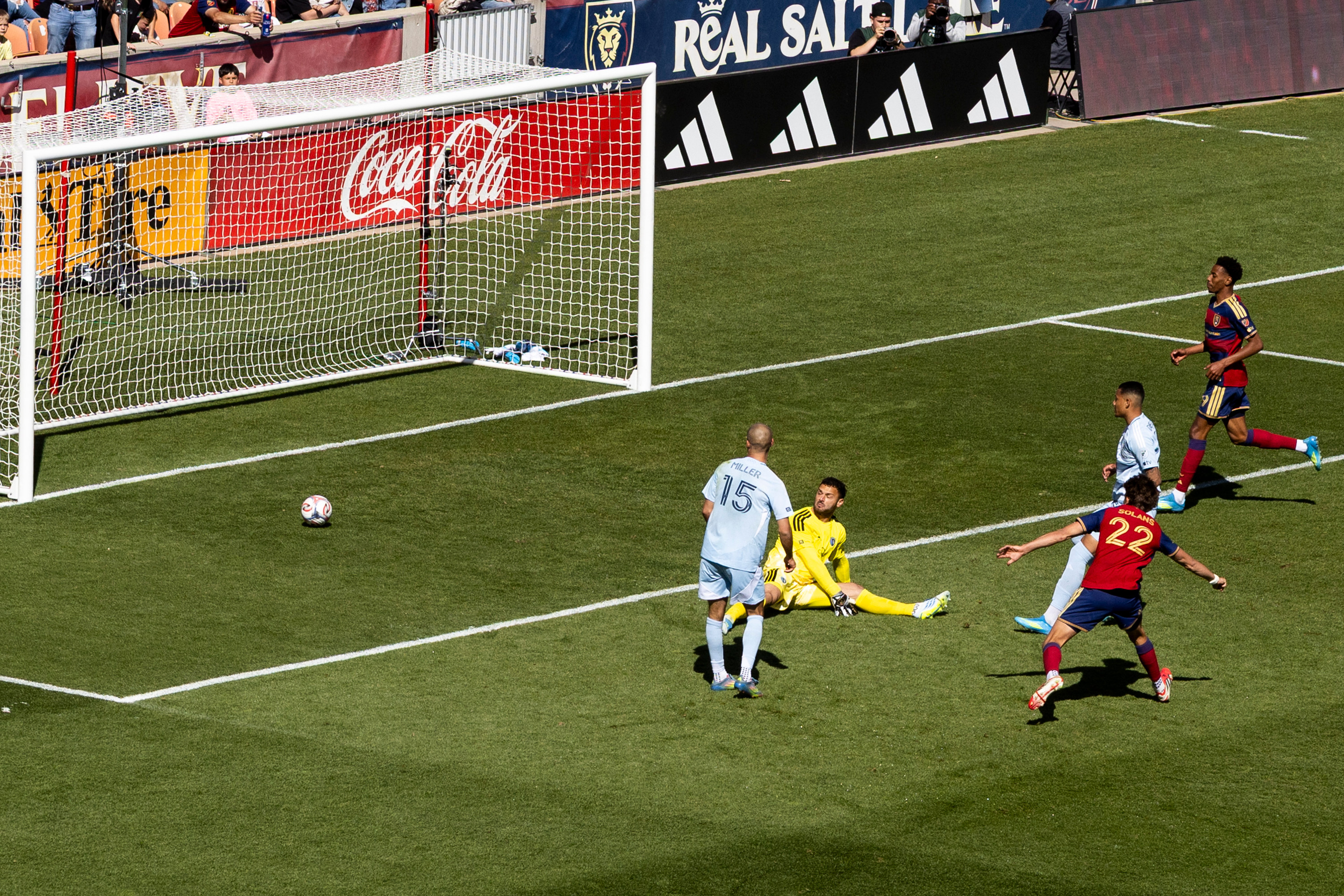 Real Salt Lake forward Sergi Solans (22) scores a goal against Sporting Kansas City goalkeeper John Pulskamp (1) during the second half of an MLS game against Sporting Kansas City at America First Field in Sandy on Saturday, April 4, 2026.