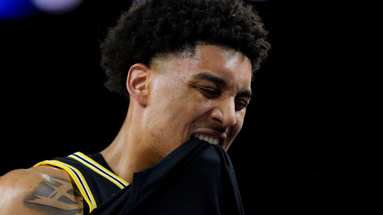 Michigan forward Yaxel Lendeborg reacts after an injury on the court during the first half of an NCAA college basketball tournament semifinal game against Arizona at the Final Four, Saturday, April 4, 2026, in Indianapolis.