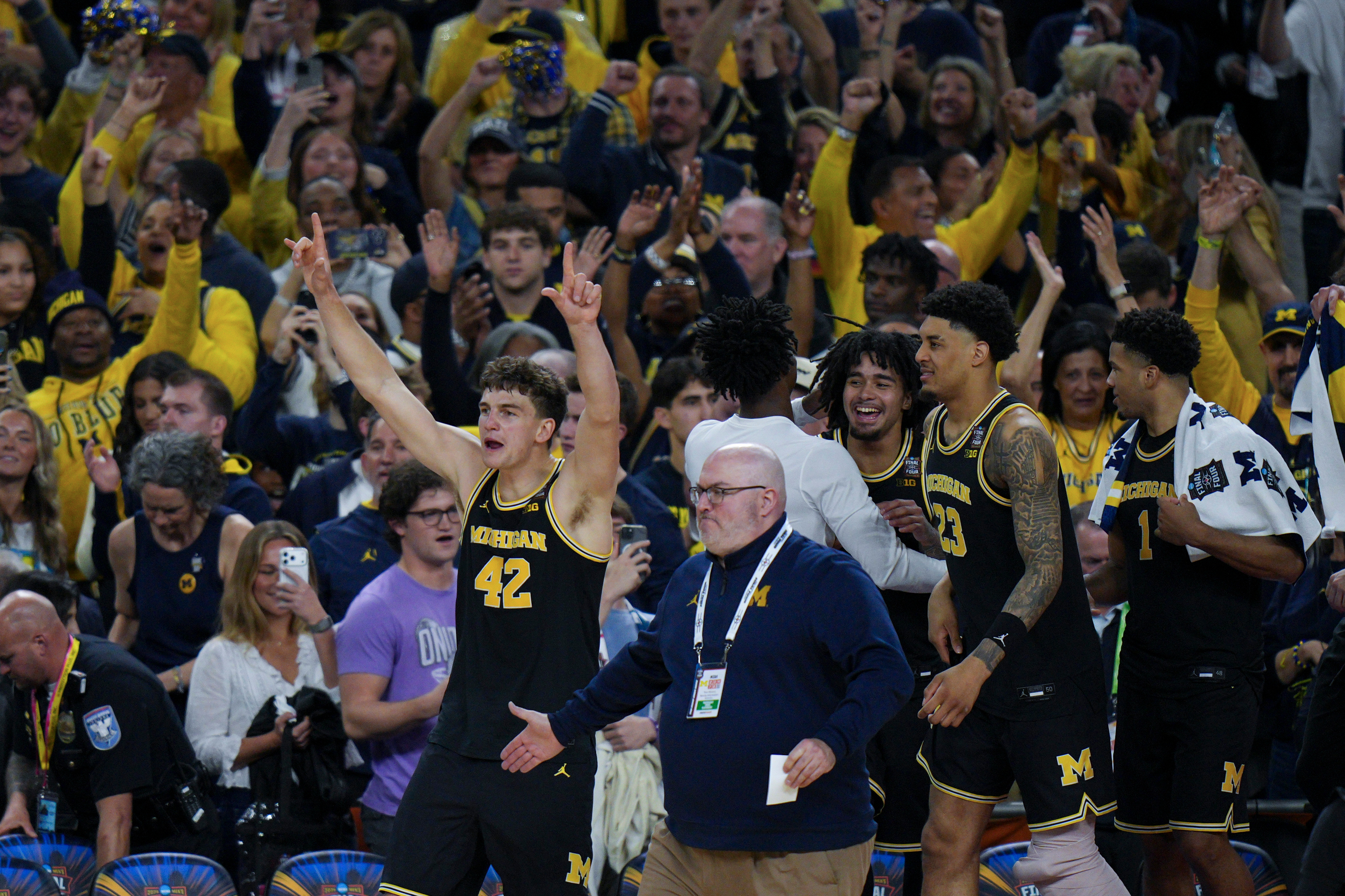 Michigan forward Will Tschetter (42) celebrates after an NCAA college basketball tournament semifinal game against Arizona at the Final Four, Saturday, April 4, 2026, in Indianapolis.