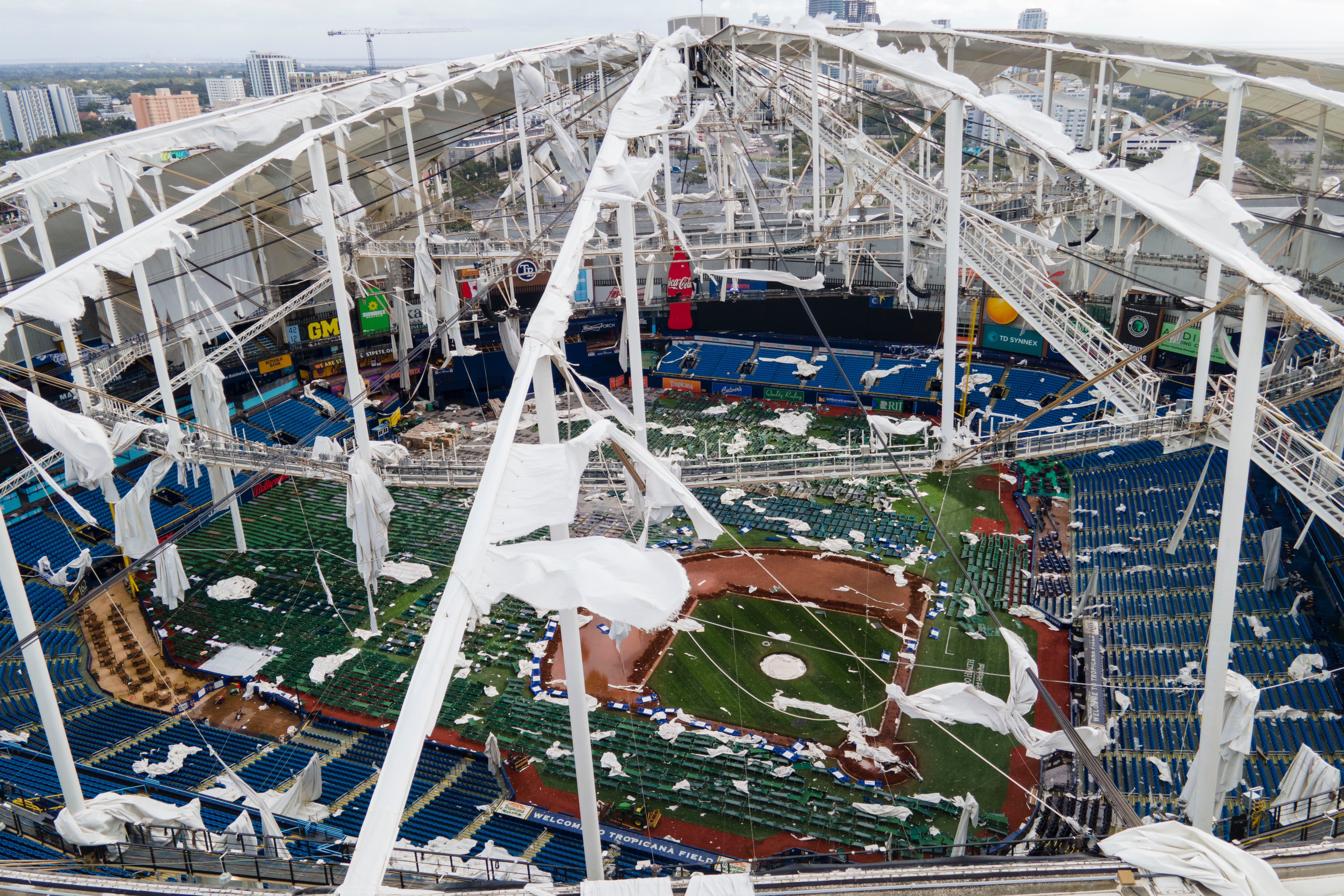 FILE - The roof of the Tropicana Field is damaged the morning after Hurricane Milton hit the region, Oct. 10, 2024, in St. Petersburg, Fla.