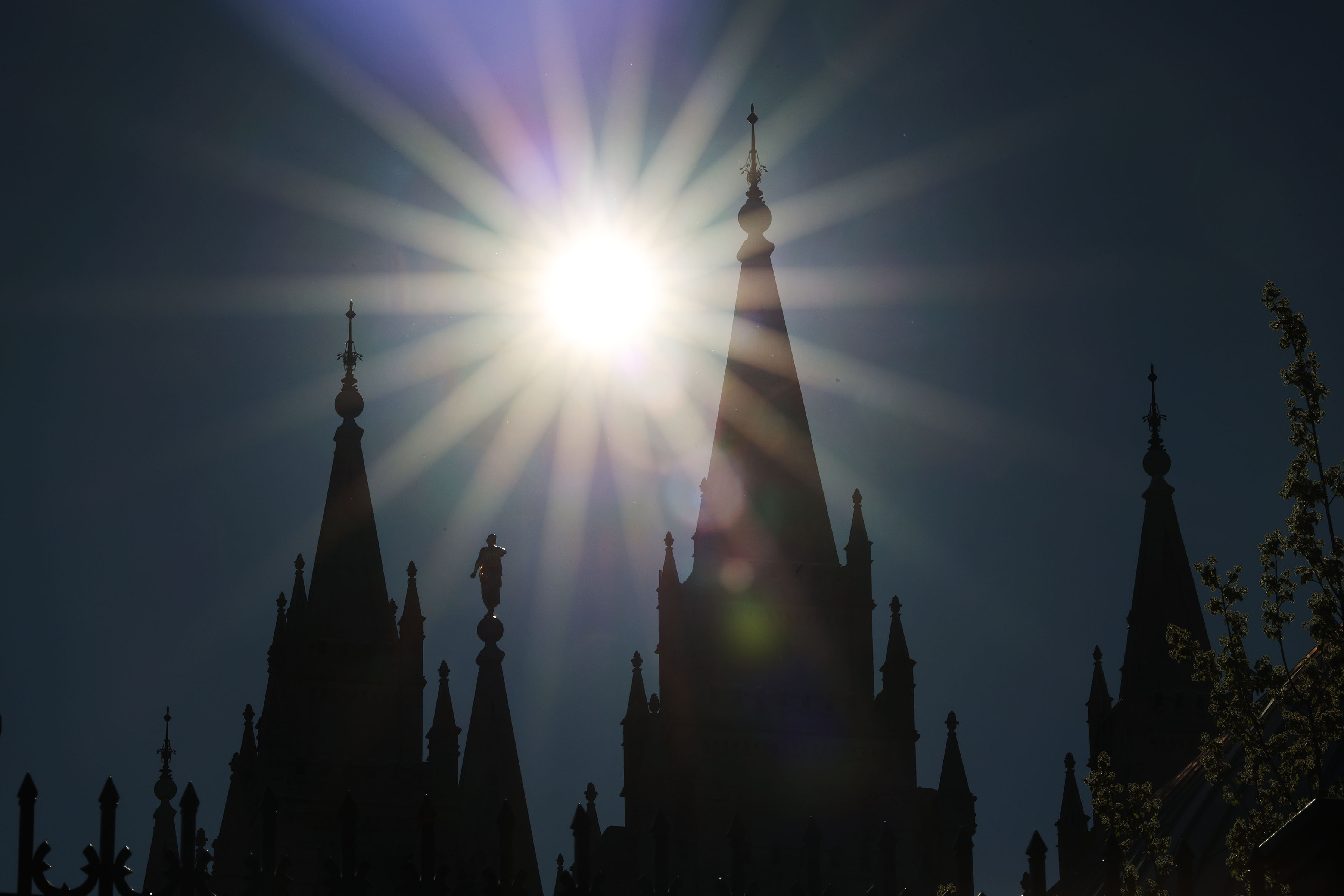 The sun shines on the Salt Lake Temple during general conference of The Church of Jesus Christ of Latter-day Saints at the Conference Center in Salt Lake City on Sunday.