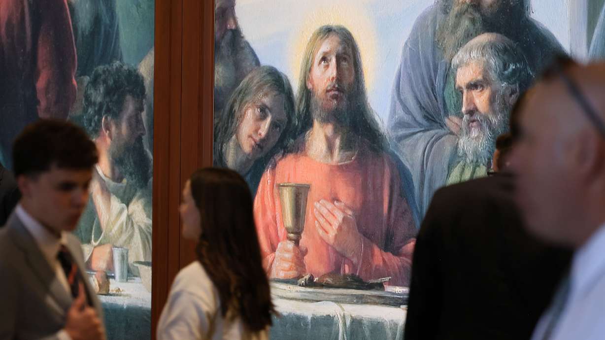 Attendees walk into the 196th Annual General Conference of The Church of Jesus Christ of Latter-day Saints at the Conference Center in Salt Lake City on Sunday.