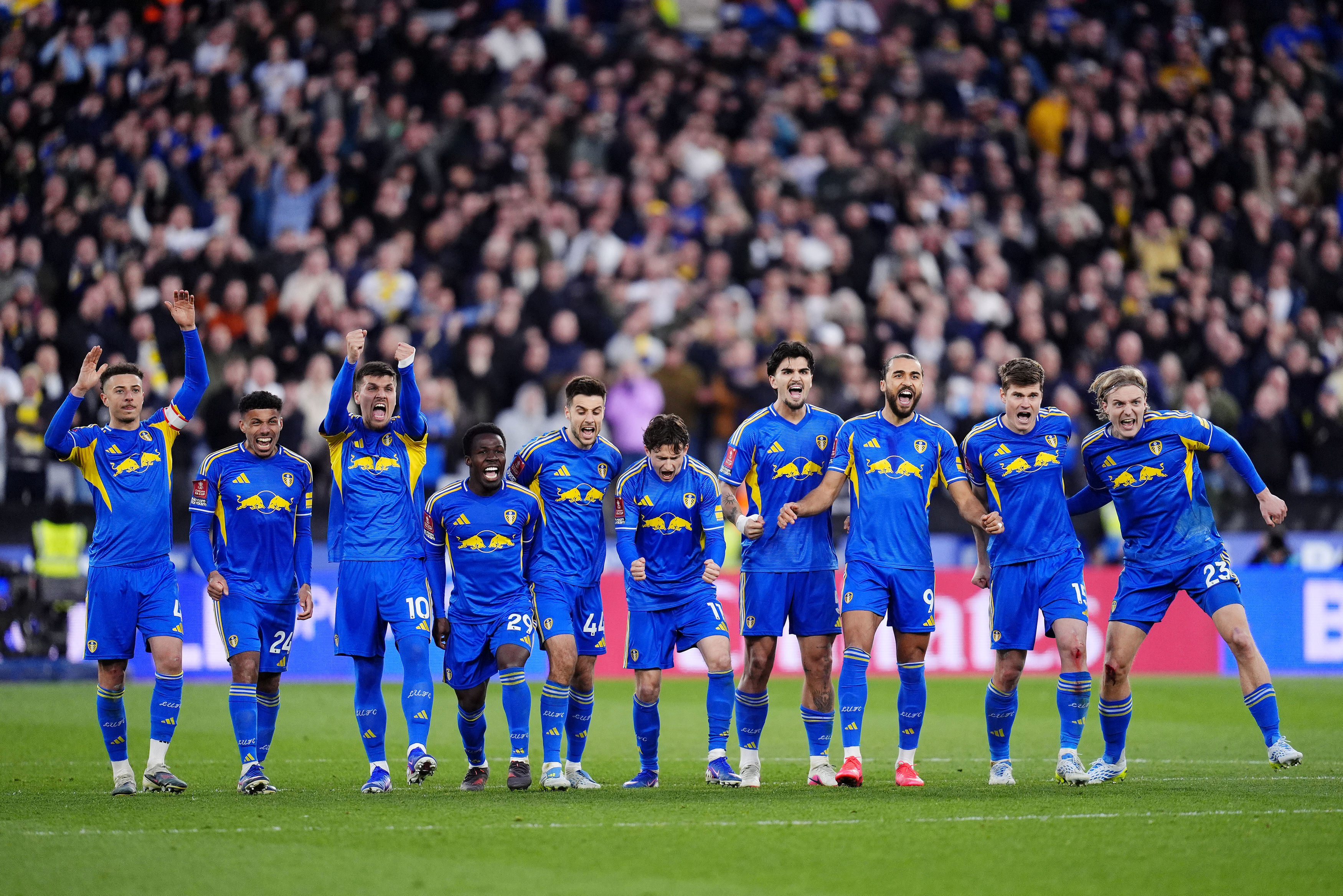 Leeds United's Dominic Calvert-Lewin, third right, and teammates celebrate in the penalty shoot-out during the English FA Cup quarterfinal soccer match between West Ham United and Leeds United, in London, Sunday April 5, 2026.