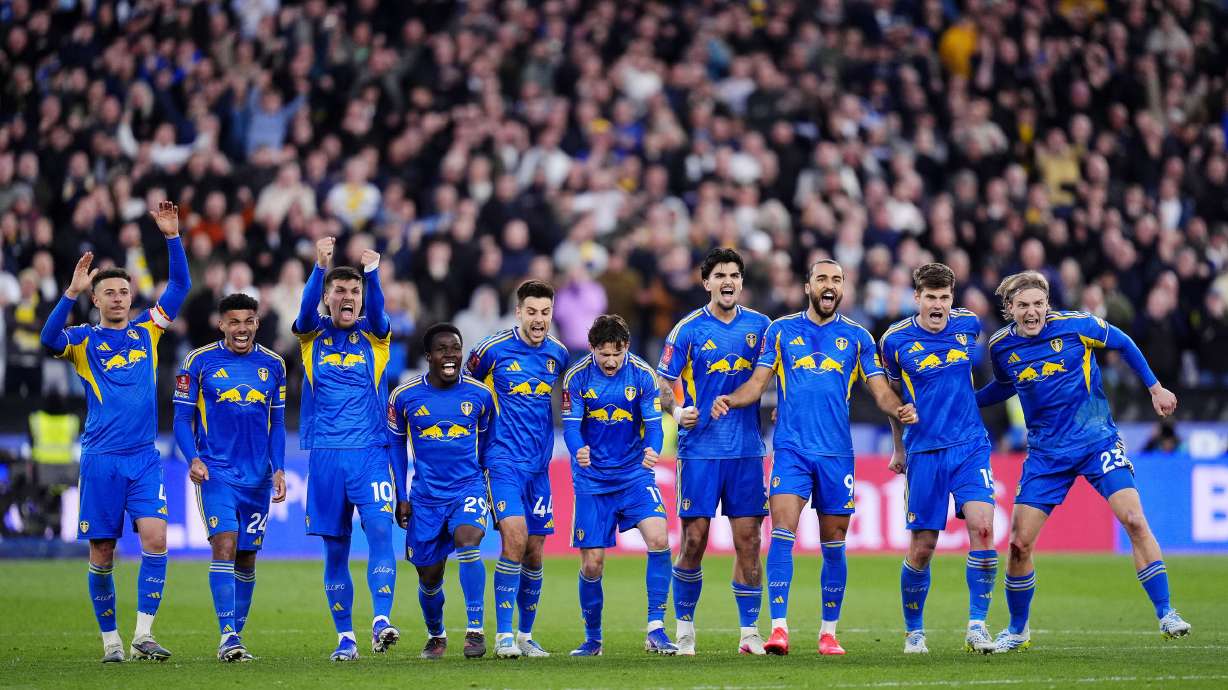 Leeds United's Dominic Calvert-Lewin, third right, and teammates celebrate in the penalty shoot-out during the English FA Cup quarterfinal soccer match between West Ham United and Leeds United, in London, Sunday April 5, 2026.