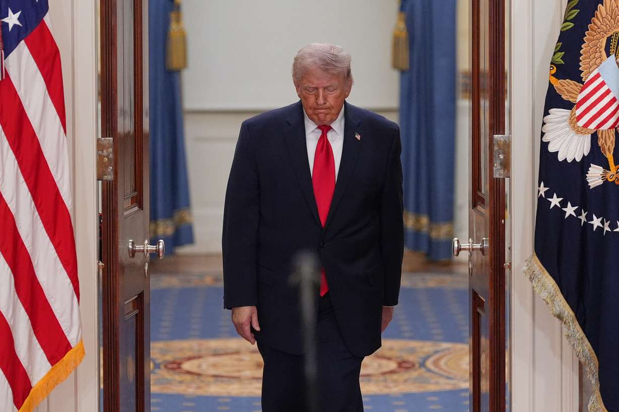 President Donald Trump arrives to speak about the Iran war from the Cross Hall of the White House on April 1 in Washington. Trump insisted recent U.S. action in Iran did not mean a return to war, as the House passed a war powers resolution on Thursday.