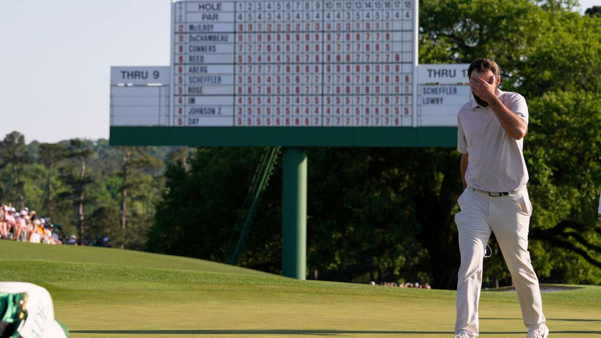FILE - Scottie Scheffler walks off the green on the 18th hole during the final round at the Masters golf tournament, Sunday, April 13, 2025, in Augusta, Ga.