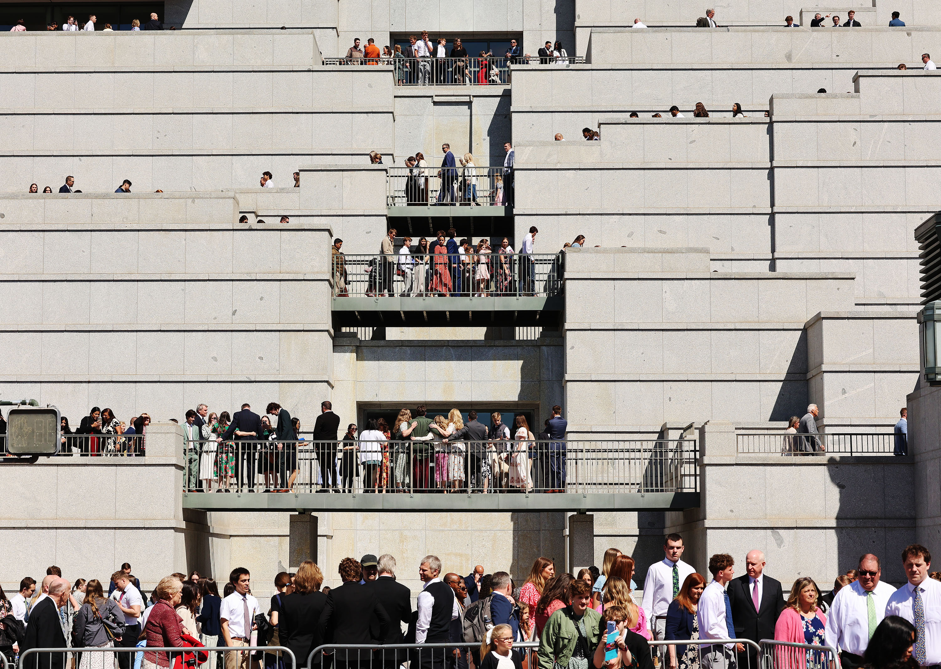 Man arrested after police say he stripped naked in front of general conference crowd