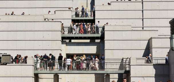 Man arrested after police say he stripped naked in front of general conference crowd