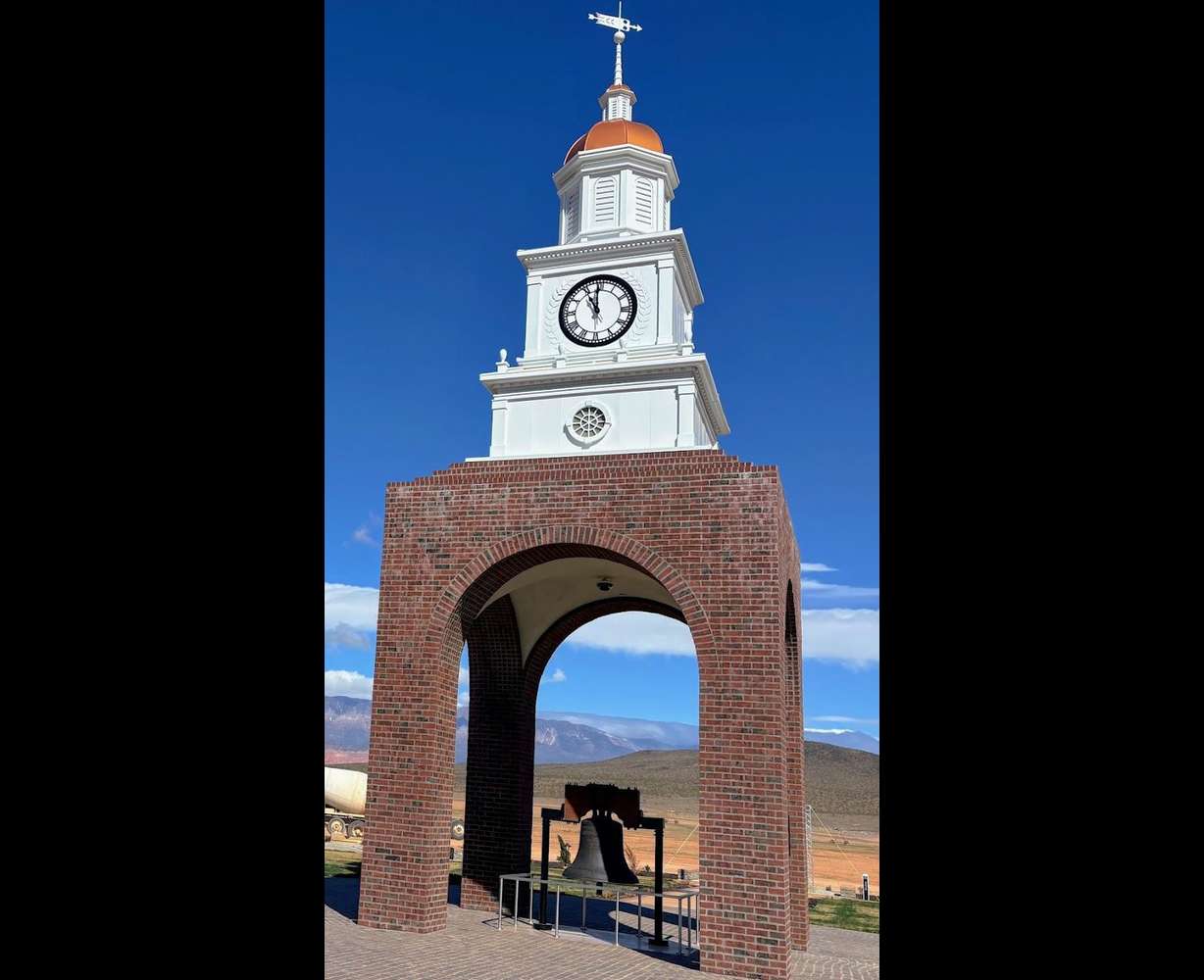 A replica of the Liberty Bell sits below the clock tower at Liberty Village outside Hurricane, Washington County.