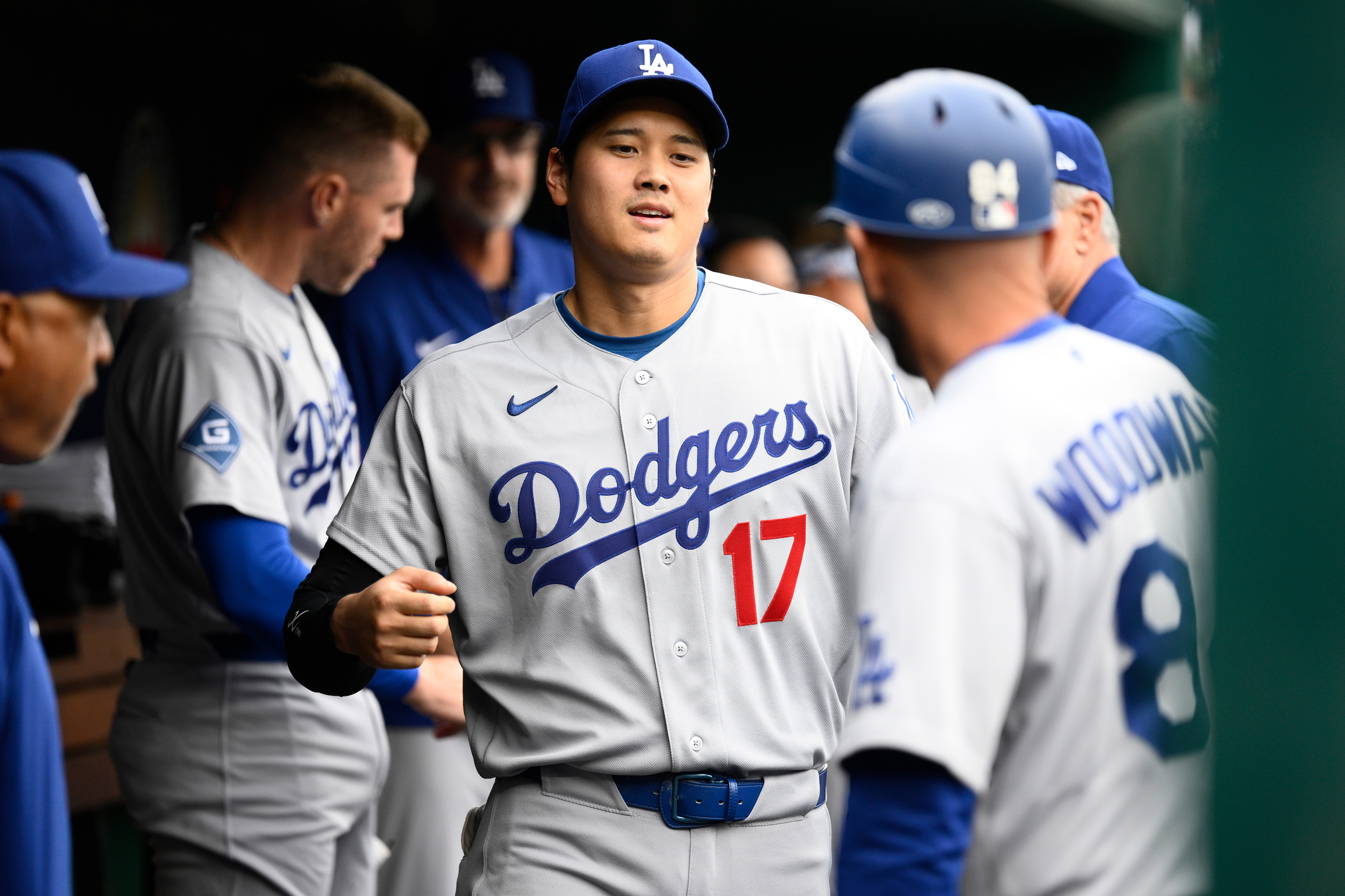 Los Angeles Dodgers' Shohei Ohtani (17) walks in the dugout before a baseball game against the Washington Nationals, Sunday, April 5, 2026, in Washington.