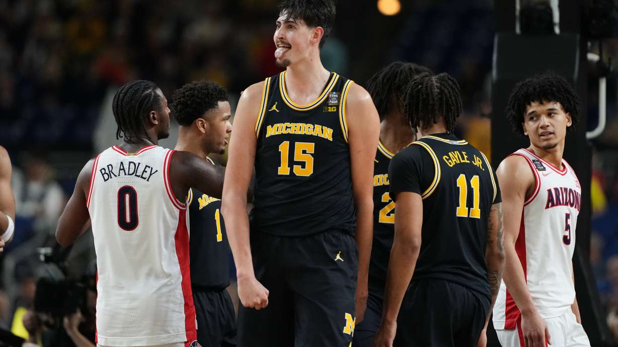 Michigan's Aday Mara (15) reacts during the second half of an NCAA college basketball tournament semifinal game against Arizona at the Final Four, Saturday, April 4, 2026, in Indianapolis.