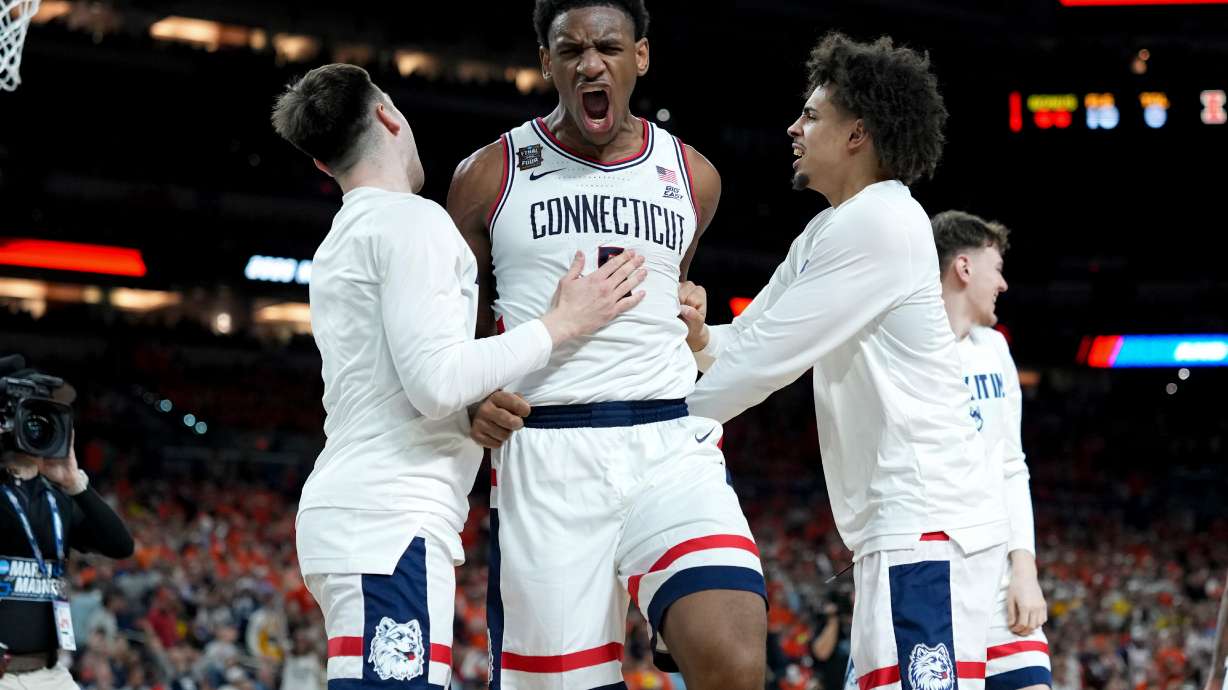 UConn forward Tarris Reed Jr., center, celebrates after the second half of an NCAA college basketball tournament semifinal game against Illinois at the Final Four, Saturday, April 4, 2026, in Indianapolis.
