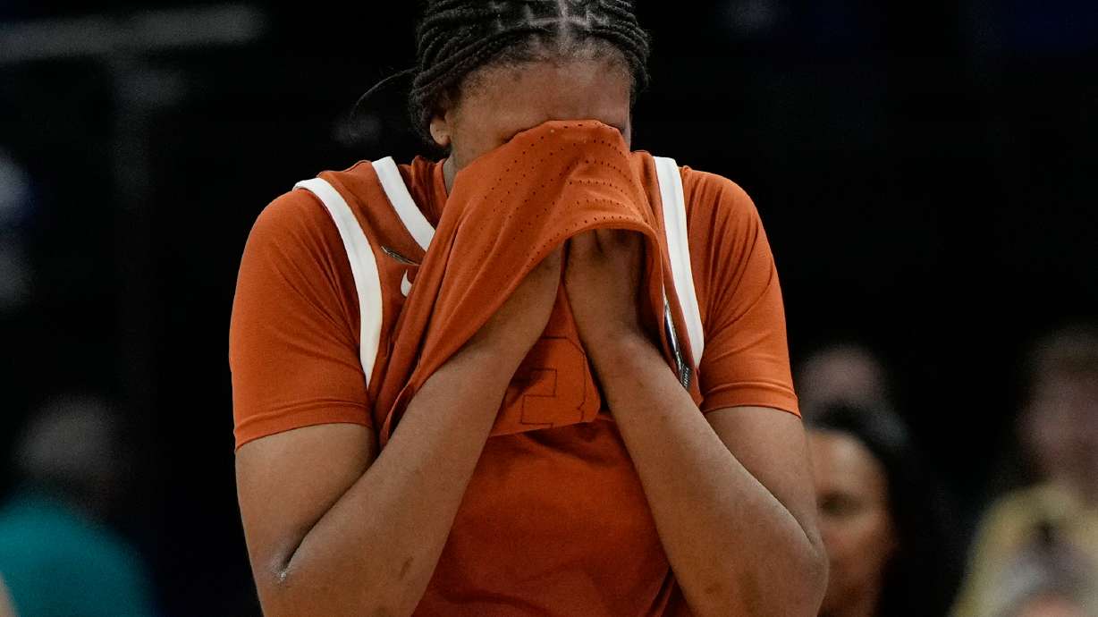 Texas forward Madison Booker (35) reacts after Texas lost to UCLA in a women's NCAA college basketball tournament semifinal game at the Final Four, Friday, April 3, 2026, in Phoenix.