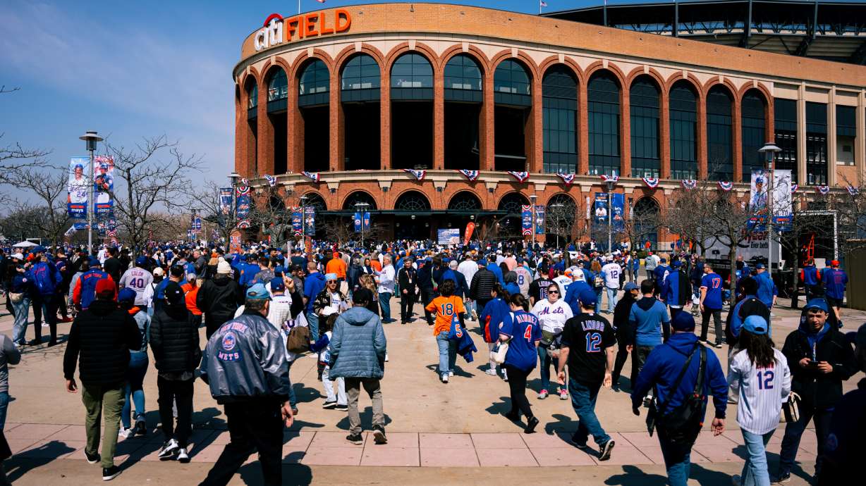 Fans arrive to Citi Field for an opening-day baseball game between the New York Mets and the Pittsburgh Pirates, Thursday, March 26, 2026, in New York.