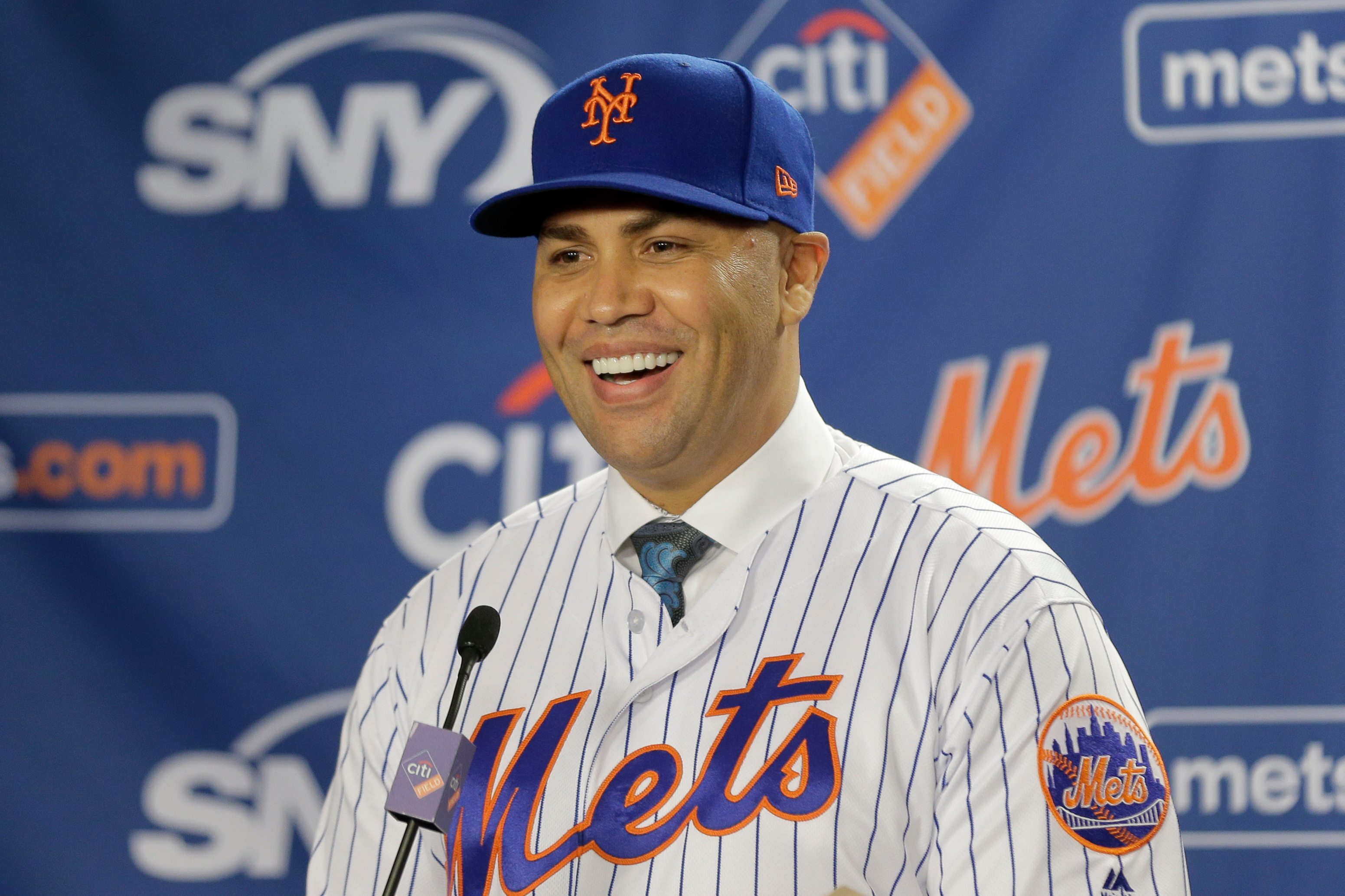FILE - New York Mets' Carlos Beltran smiles during an introductory baseball news conference in New York, Nov. 4, 2019. 
