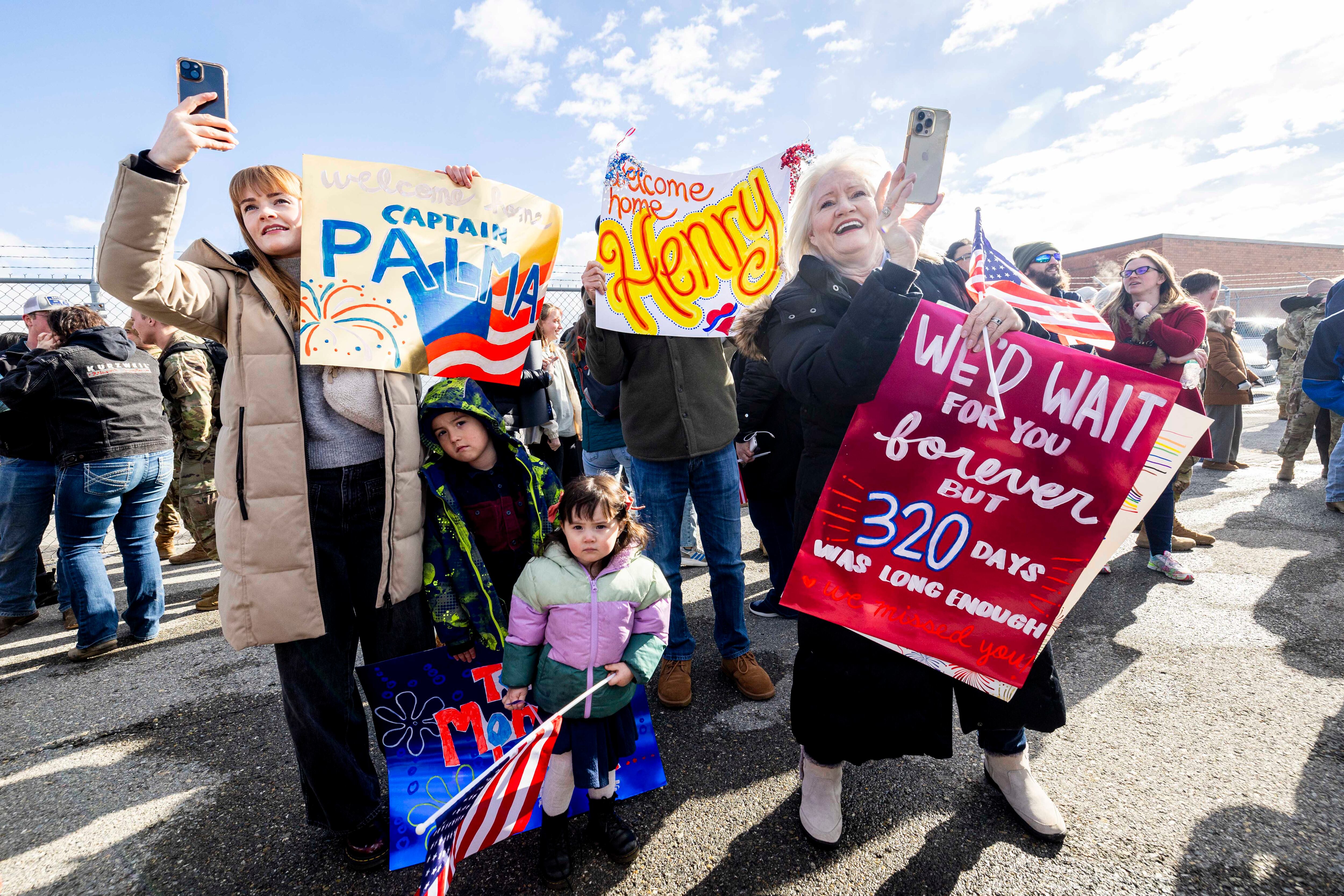 Virginia Hoffman, right, of Salt Lake City, holds a sign for her son, Cpt. Henry Palma, as she’s joined by other family members during the return of the Utah Army National Guard’s 204th Maneuver Enhancement Brigade from Africa to the Roland R. Wright Air National Guard Base in Salt Lake City on Jan. 18, 2025.