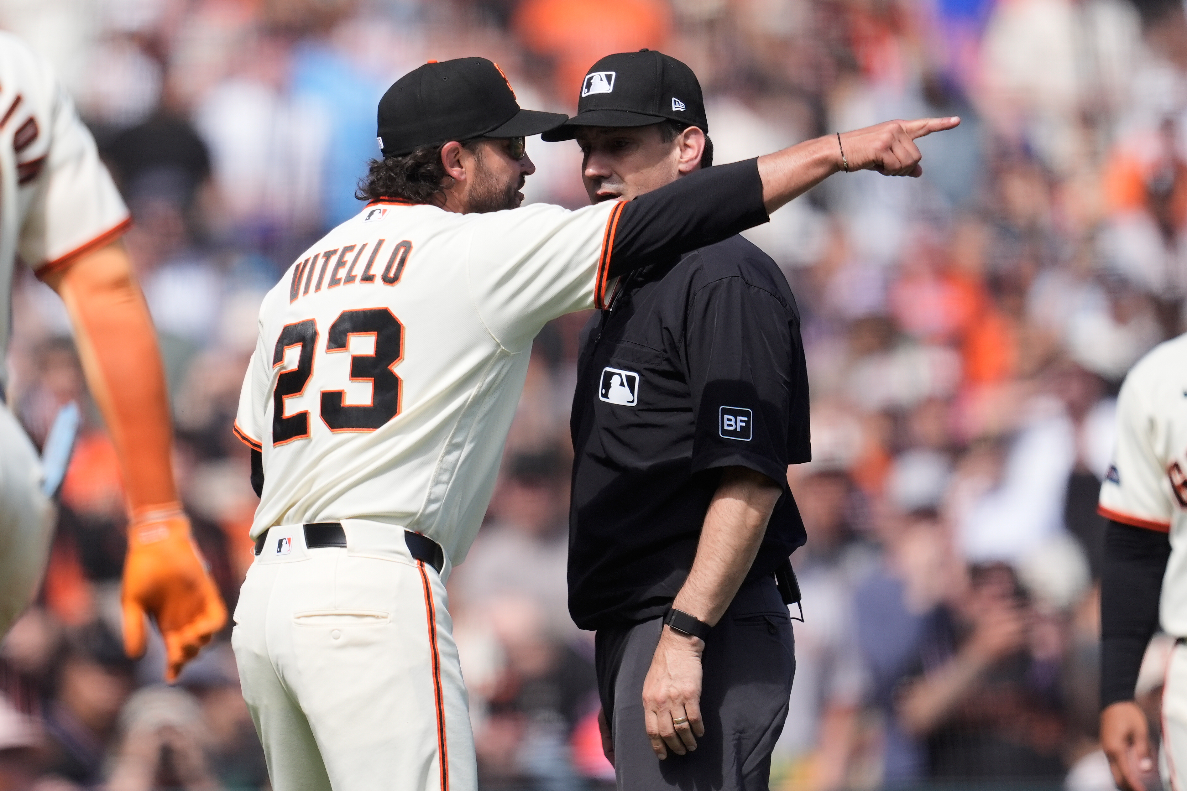 San Francisco Giants manager Tony Vitello (23) gestures after being ejected by umpire David Rackley, right, during the seventh inning of a baseball game between the Giants and the New York Mets in San Francisco, Sunday, April 5, 2026.