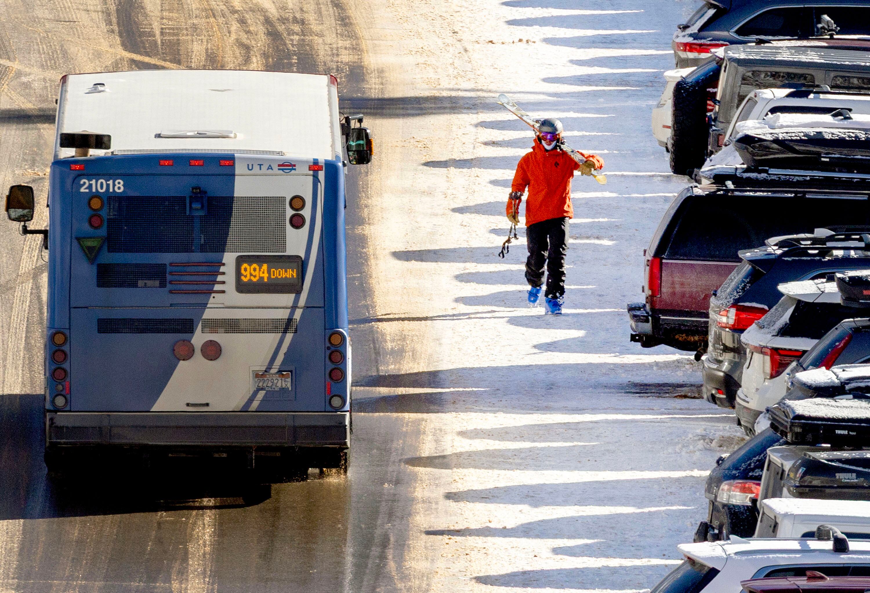 A skier walks through a parking lot at Snowbird in Little Cottonwood Canyon on Jan. 9. A recent lawsuit filed over season passes and daily lift tickets amplify the question if the passes leave snow enthusiasts better or worse off than before.