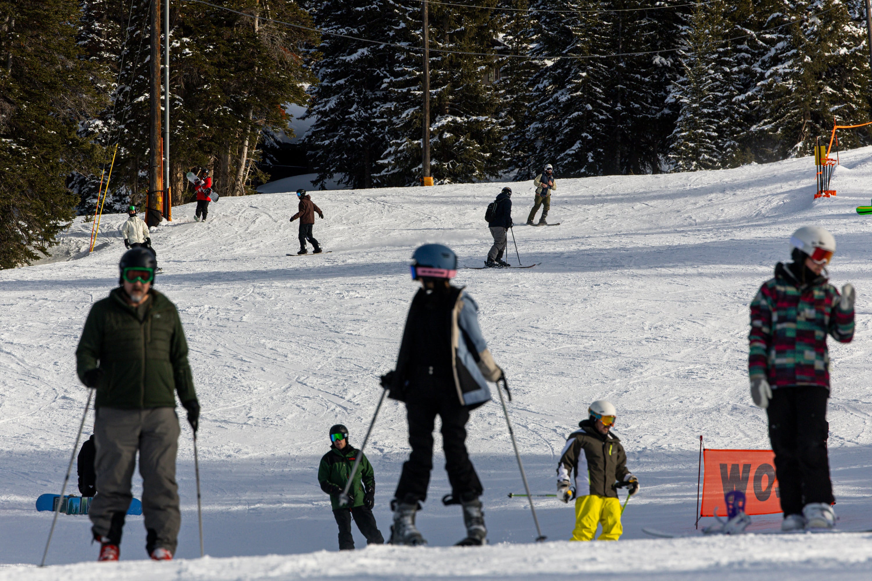 People make their way down the slopes at Brighton Ski Resort in Brighton on Feb. 22. Skiers filed a lawsuit last month in federal court that accuses resort owners of intentionally inflating daily lift prices to force users to buy season passes.