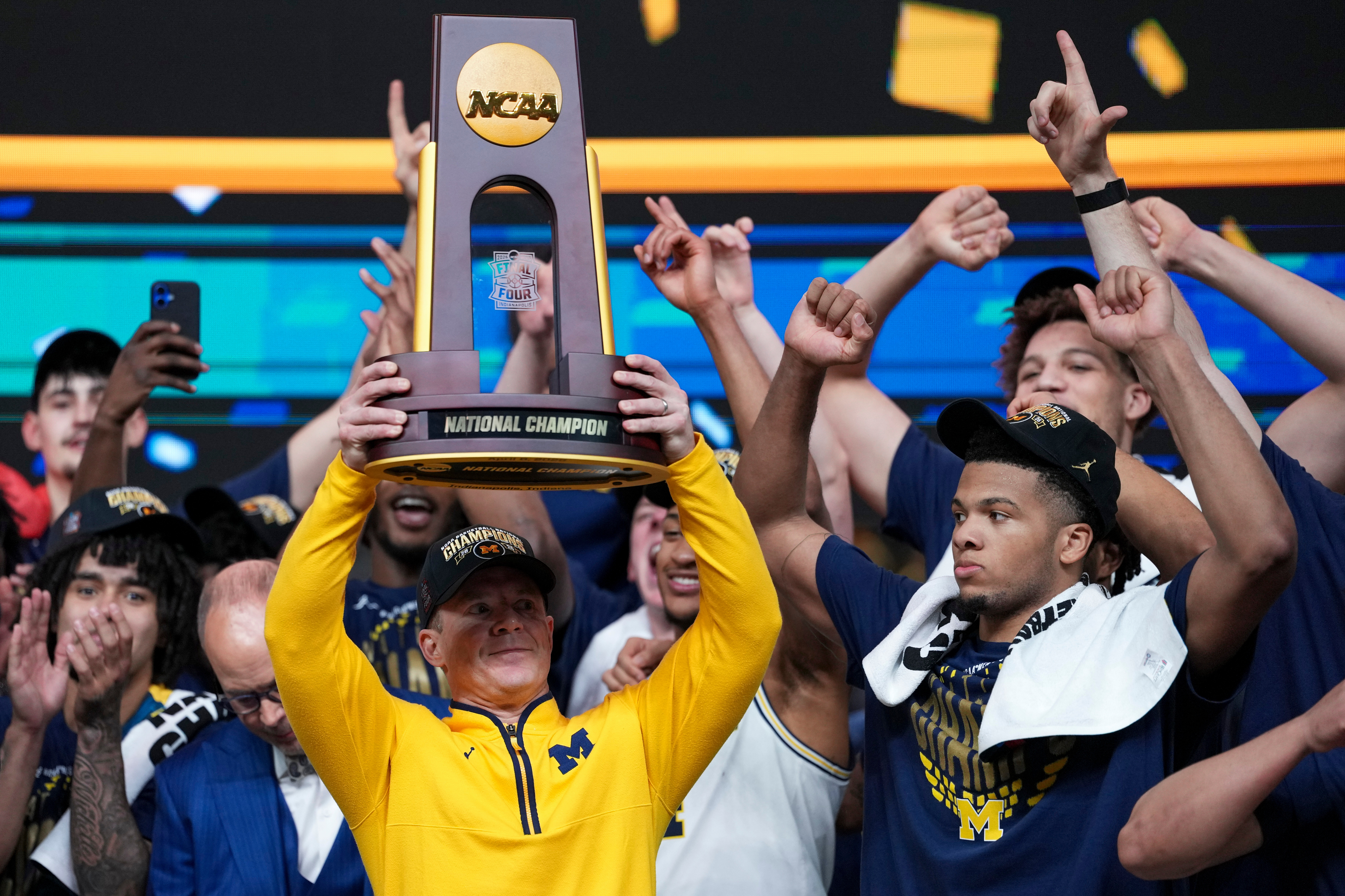 Michigan muscles its way to program's 2nd national title, beating stubborn UConn