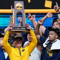 Michigan muscles its way to program's 2nd national title, beating stubborn UConn 69-63