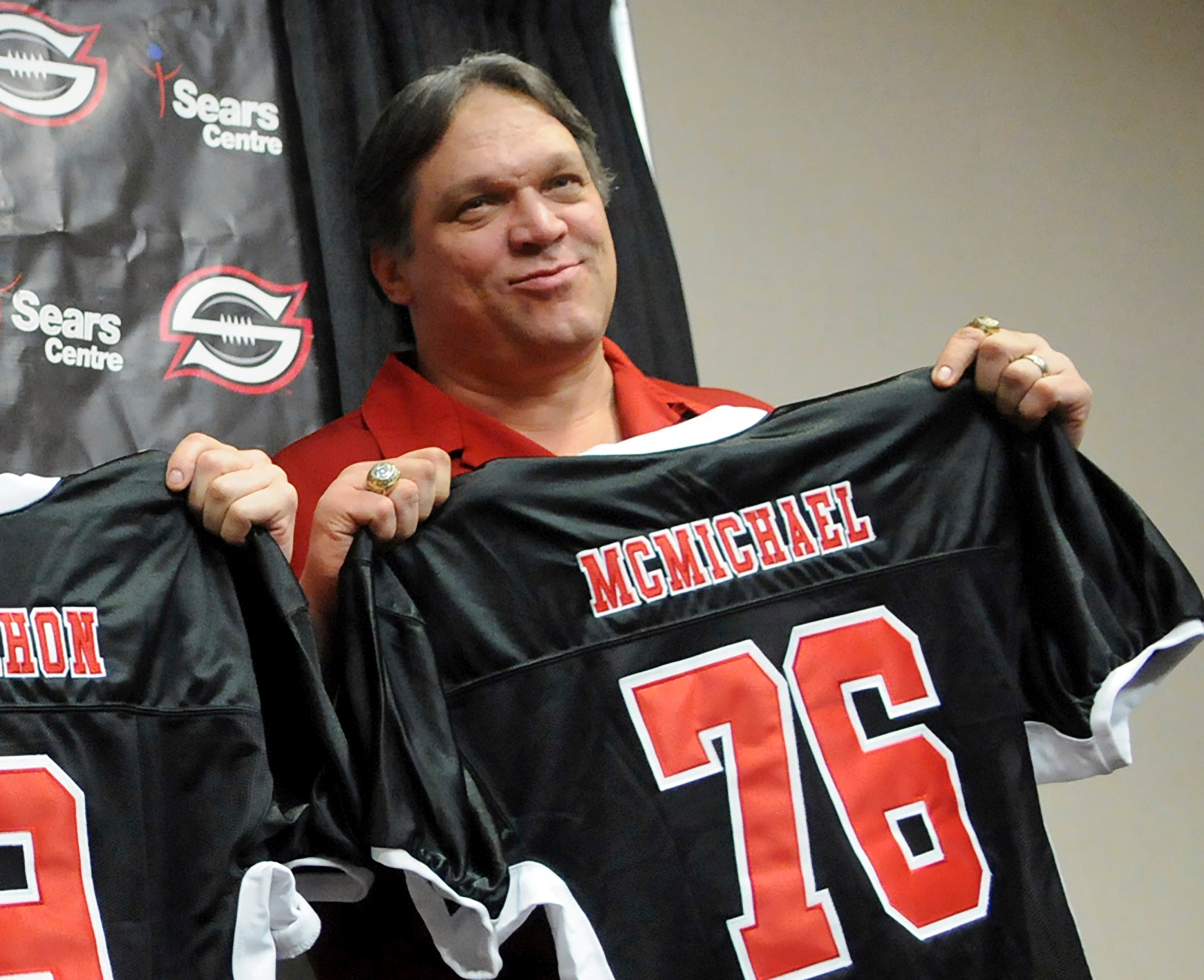FILE - Former Chicago Bears defensive tackle Steve McMichael holds a Chicago Slaughter jersey during a news conference Feb. 19, 2010, in Chicago. 