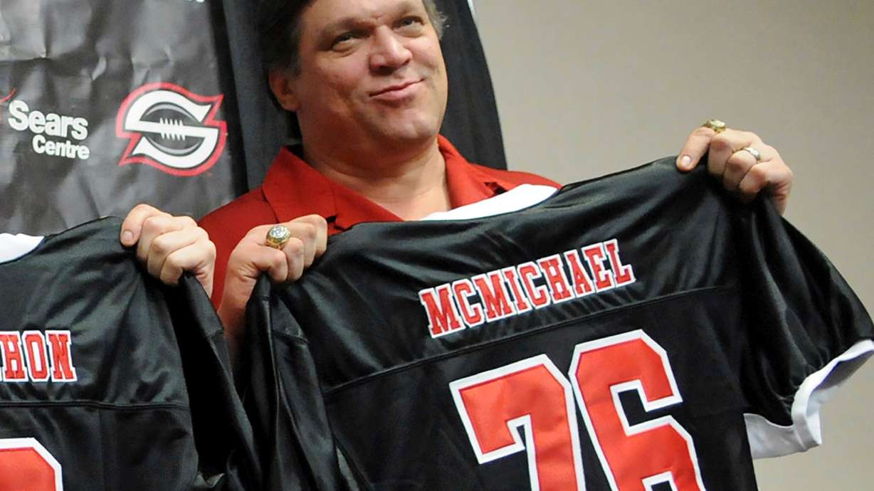FILE - Former Chicago Bears defensive tackle Steve McMichael holds a Chicago Slaughter jersey during a news conference Feb. 19, 2010, in Chicago.