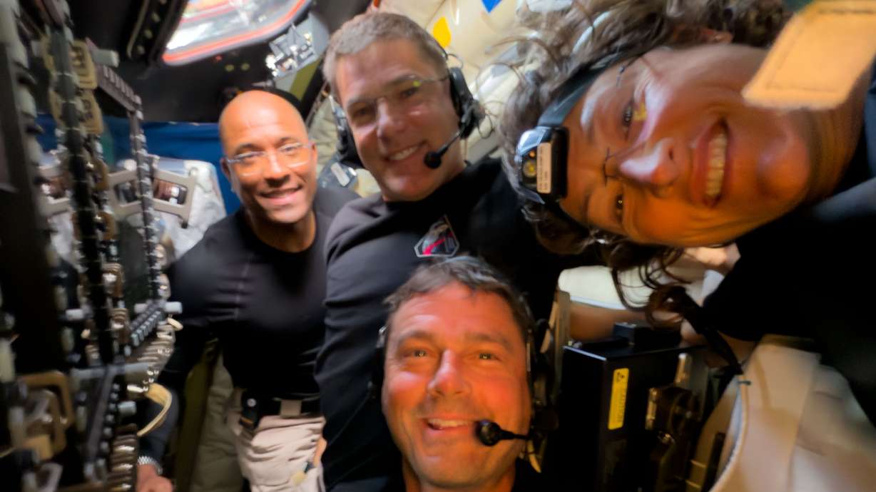 Artemis II crew members Jeremy Hansen, Victor Glover, Reid Wiseman and Christina Koch take a selfie during their lunar flyby, Monday. The crew put in a historic call to the International Space Station on Tuesday.