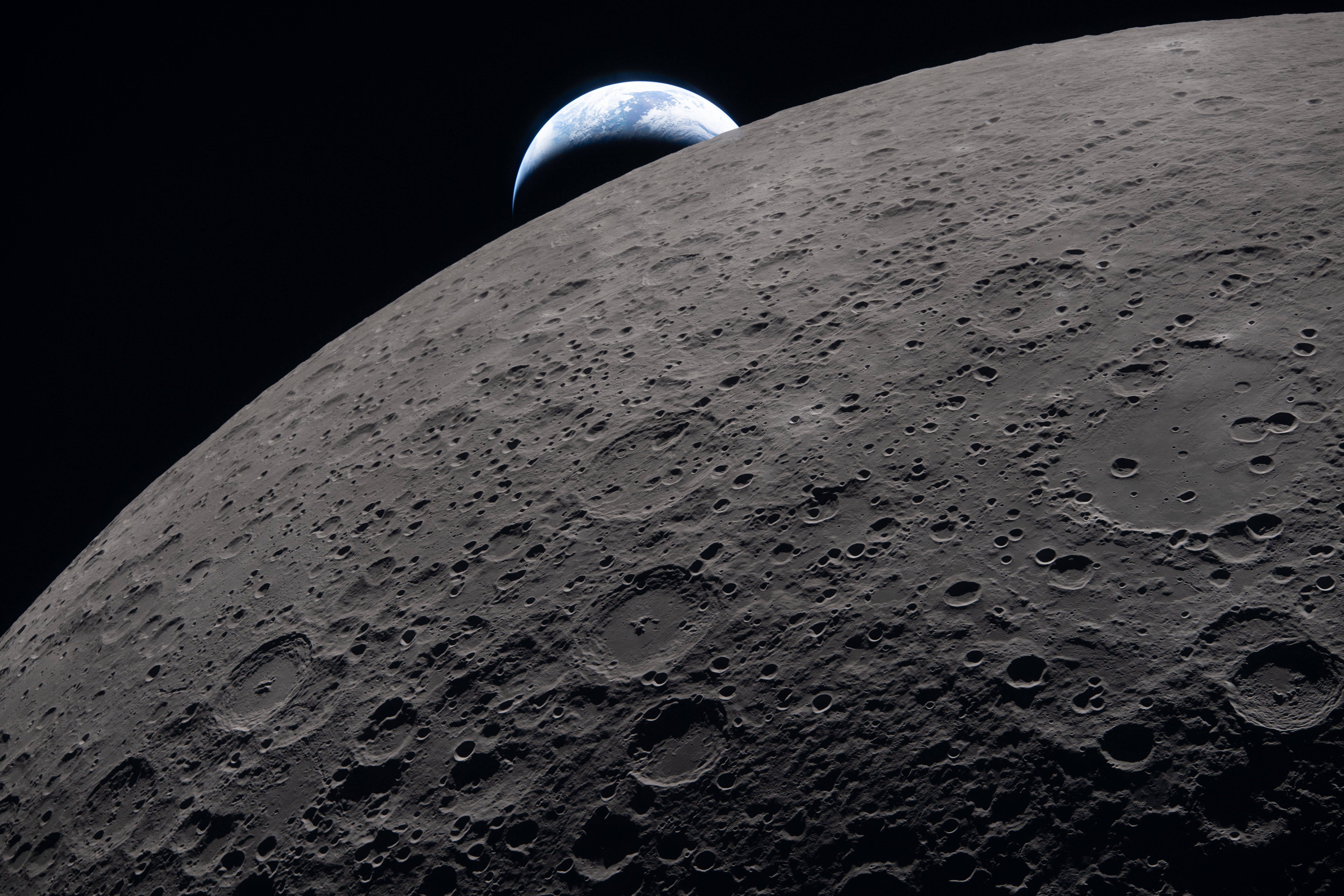 The Artemis II crew captured this view as the Earth set behind the Moon during a lunar flyby on Monday.