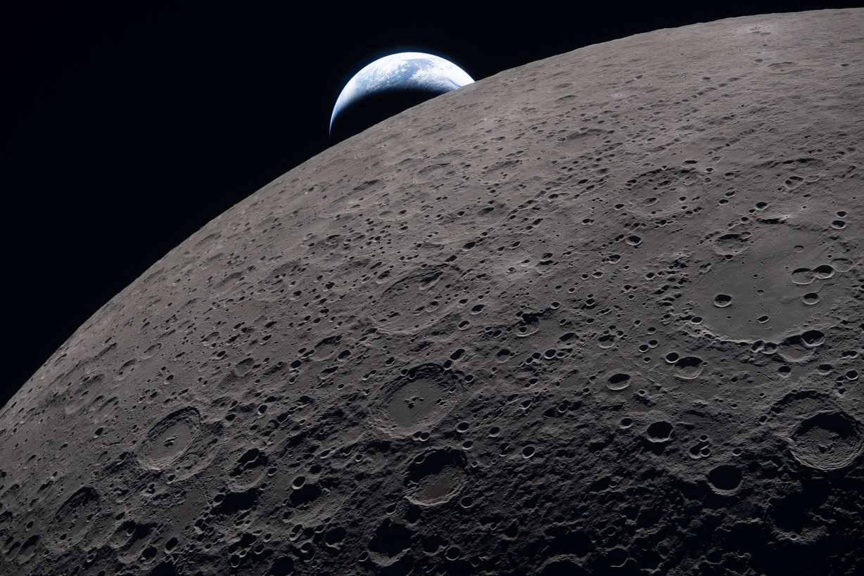 The Artemis II crew captured this view as the Earth set behind the Moon during a lunar flyby on Monday.